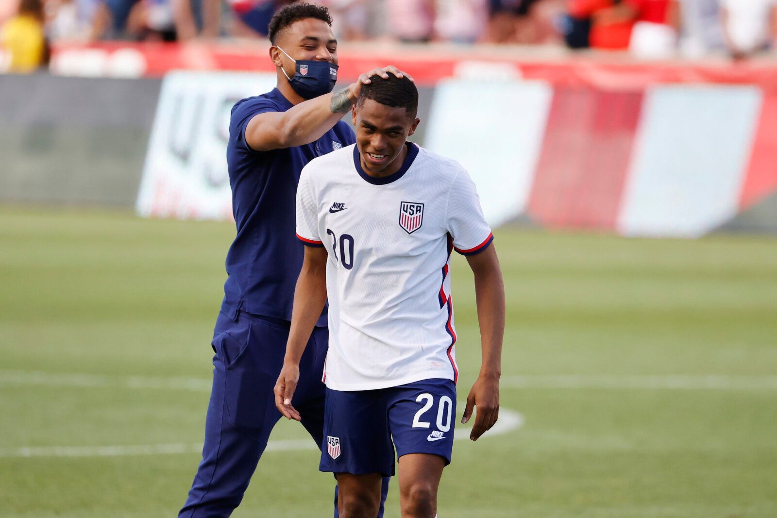 Jun 9, 2021; Sandy, Utah, USA; United States defender Reggie Cannon (20) is congratulated after their 4-0 win against Costa Rica during an international friendly soccer match at Rio Tinto Stadium. Mandatory Credit: Jeffrey Swinger-USA TODAY Sports