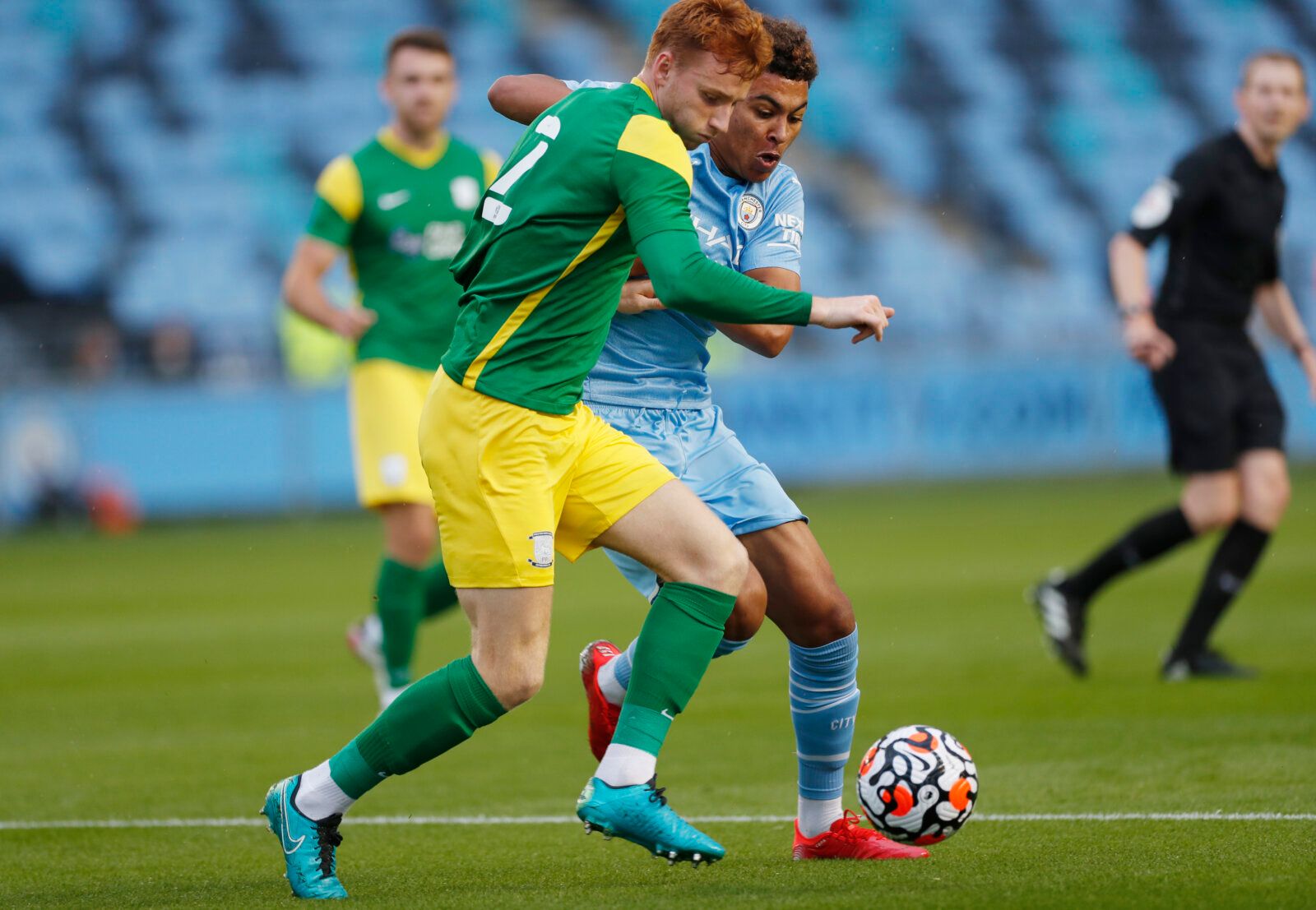 Soccer Football - Pre Season Friendly - Manchester City v Preston North End - Manchester City Academy Stadium, Manchester, Britain - July 27, 2021  Manchester City's Morgan Rogers in action with Preston North End's Sepp Van Den Berg Action Images via Reuters/Lee Smith