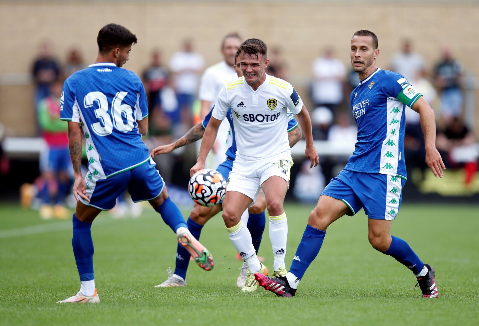 Soccer Football - Pre Season Friendly - Leeds United v Real Betis - Loughborough University Stadium, Loughborough, Britain - July 31, 2021 Leeds United's Jamie Shackleton in action with Real Betis' Sergio Canales  Action Images via Reuters/Ed Sykes