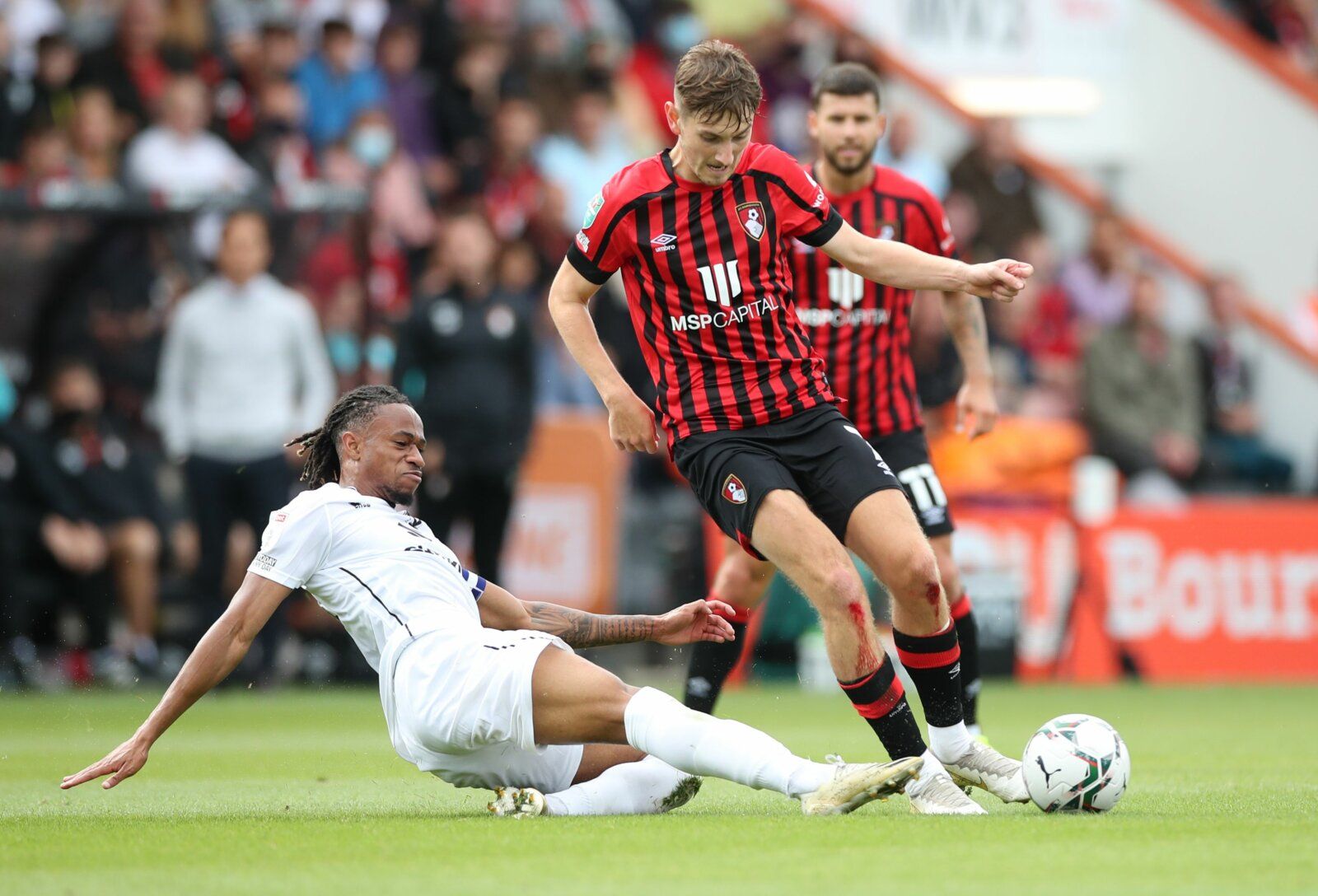 Soccer Football - Carabao Cup First Round - AFC Bournemouth v Milton Keynes Dons - Vitality Stadium, Bournemouth, Britain - July 31, 2021  AFC Bournemouth's David Brooks in action with Milton Keynes Dons' David Kasumu Action Images/Peter Cziborra