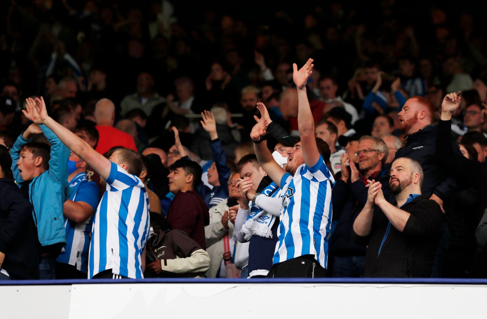 Soccer Football - Carabao Cup First Round - Sheffield Wednesday v Huddersfield Town - Hillsborough, Sheffield, Britain - August 1, 2021 Huddersfield Town fans celebrate after the penalty shootout Action Images/Lee Smith