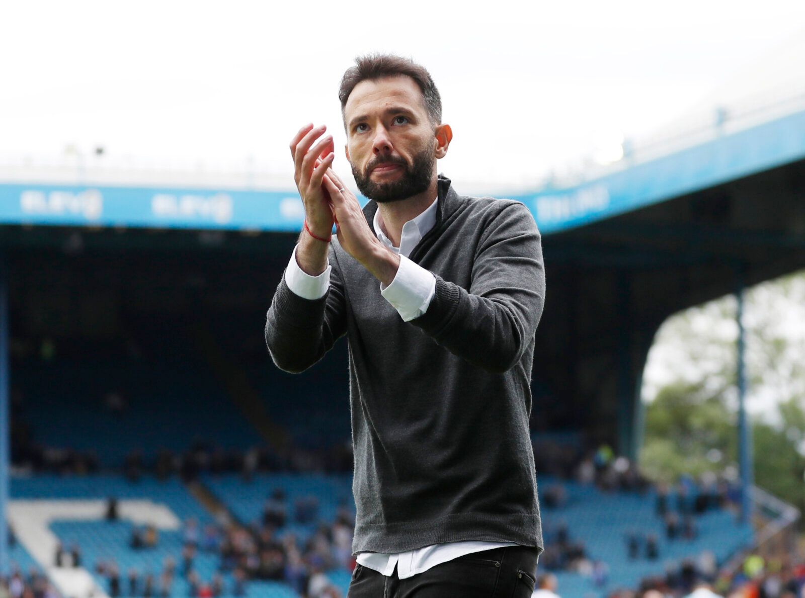 Soccer Football - Carabao Cup First Round - Sheffield Wednesday v Huddersfield Town - Hillsborough, Sheffield, Britain - August 1, 2021 Huddersfield Town manager Carlos Corberan applauds the fans after the match Action Images/Lee Smith