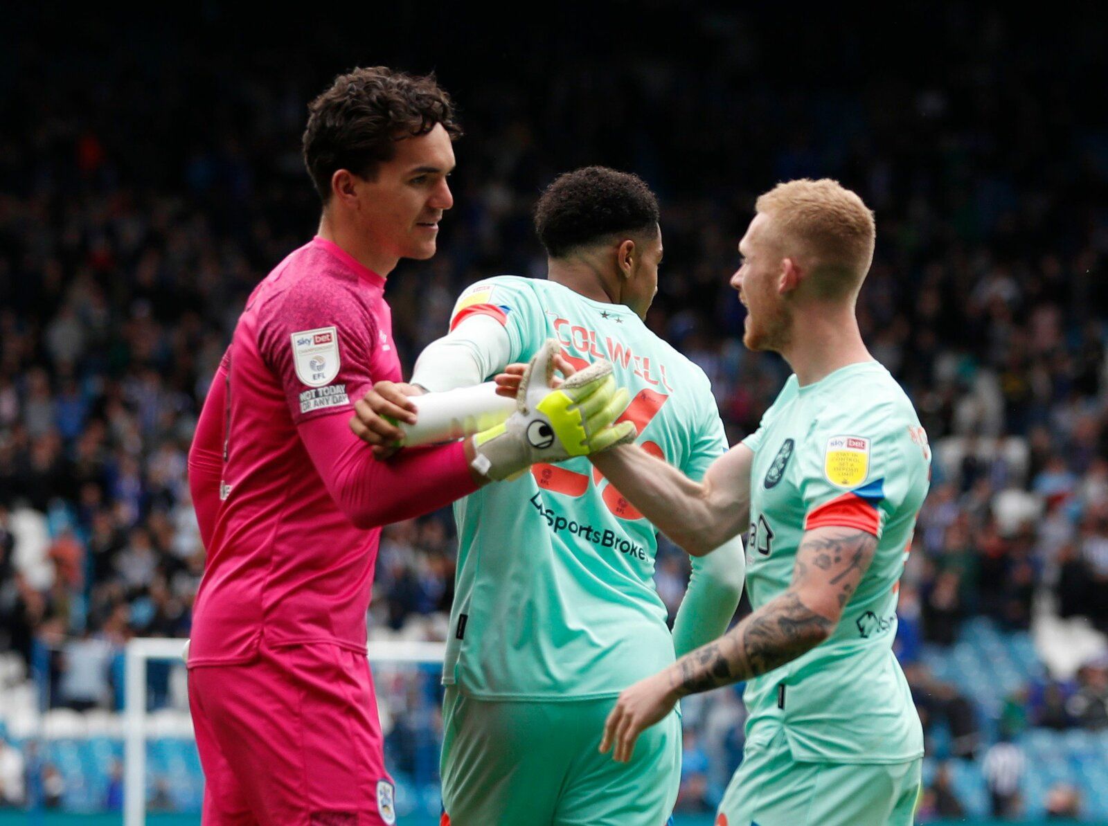 Soccer Football - Carabao Cup First Round - Sheffield Wednesday v Huddersfield Town - Hillsborough, Sheffield, Britain - August 1, 2021 Huddersfield Town's Lee Nicholls and Lewis O'Brien celebrate after the penalty shootout Action Images/Lee Smith
