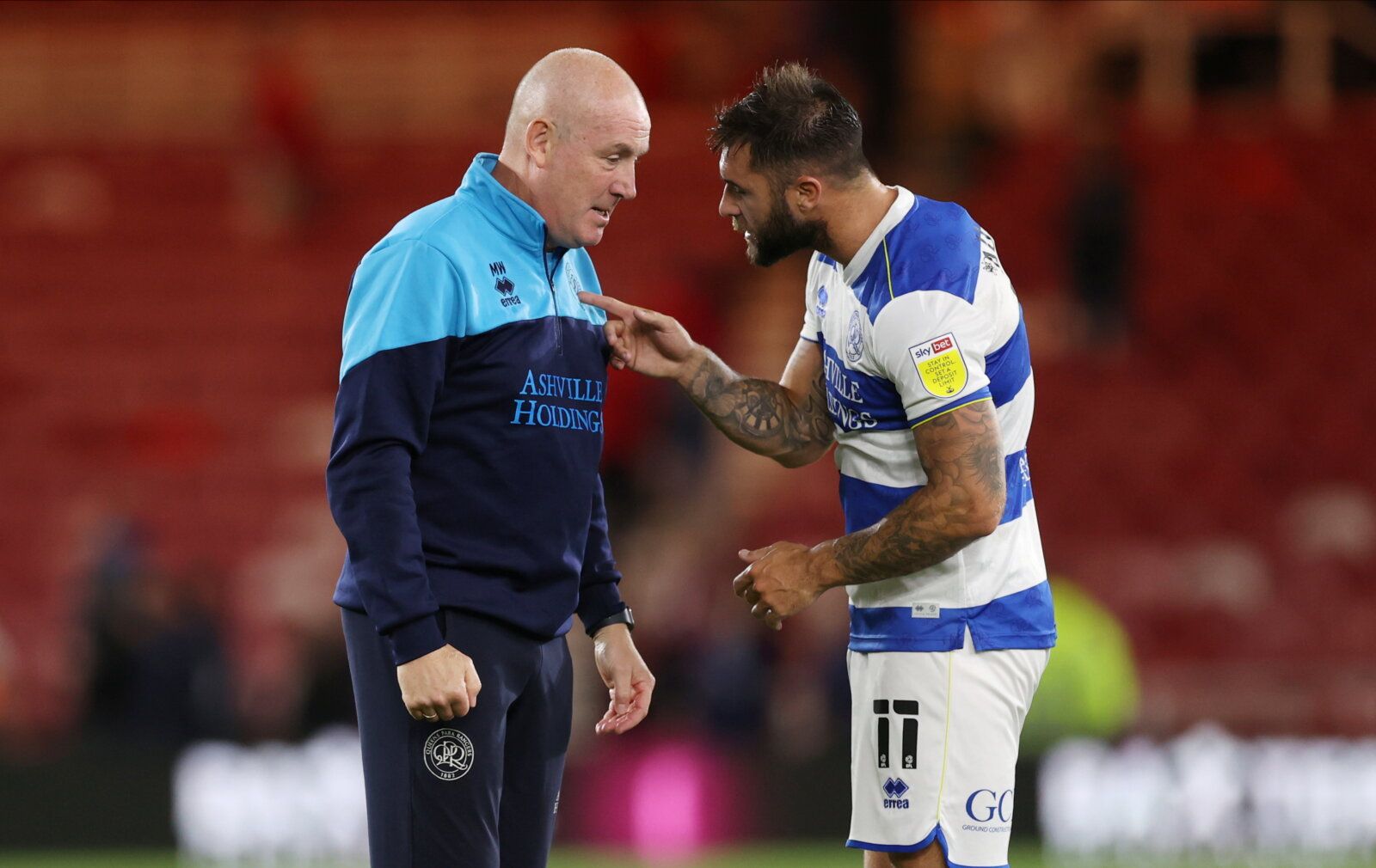 Soccer Football - Championship - Middlesbrough v Queens Park Rangers - Riverside Stadium, Middlesbrough, Britain - August 18, 2021   QPR manager Mark Warburton with Charlie Austin after the match     Action Images/Lee Smith    EDITORIAL USE ONLY. No use with unauthorized audio, video, data, fixture lists, club/league logos or "live" services. Online in-match use limited to 75 images, no video emulation. No use in betting, games or single club/league/player publications.  Please contact your acco