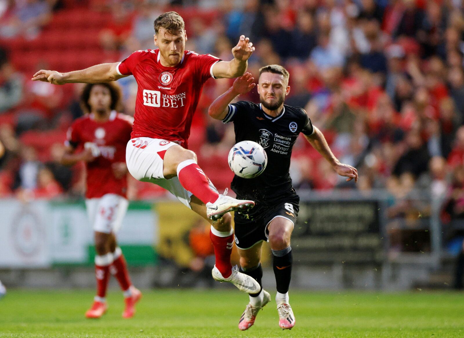 Soccer Football - Championship - Bristol City v Swansea City - Ashton Gate Stadium, Bristol, Britain - August 20, 2021  Bristol City’s Chris Martin in action with Swansea City's Matt Grimes  Action Images/John Sibley  EDITORIAL USE ONLY. No use with unauthorized audio, video, data, fixture lists, club/league logos or "live" services. Online in-match use limited to 75 images, no video emulation. No use in betting, games or single club/league/player publications.  Please contact your account repre