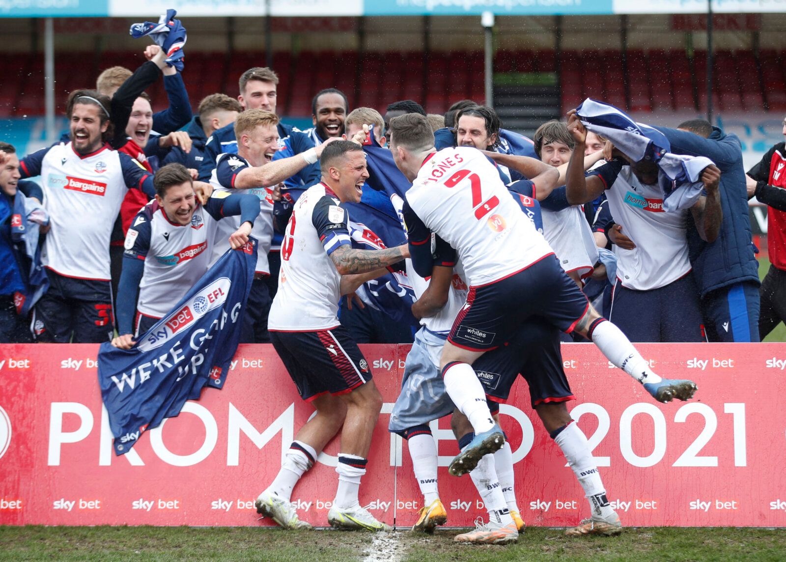 Soccer Football - League Two - Crawley Town v Bolton Wanderers- The People's Pension Stadium, Crawley, Britain - May 8, 2021  Bolton Wanderers players celebrate promotion to League One after the match Action Images/Matthew Childs EDITORIAL USE ONLY. No use with unauthorized audio, video, data, fixture lists, club/league logos or 'live' services. Online in-match use limited to 75 images, no video emulation. No use in betting, games or single club /league/player publications.  Please contact your 