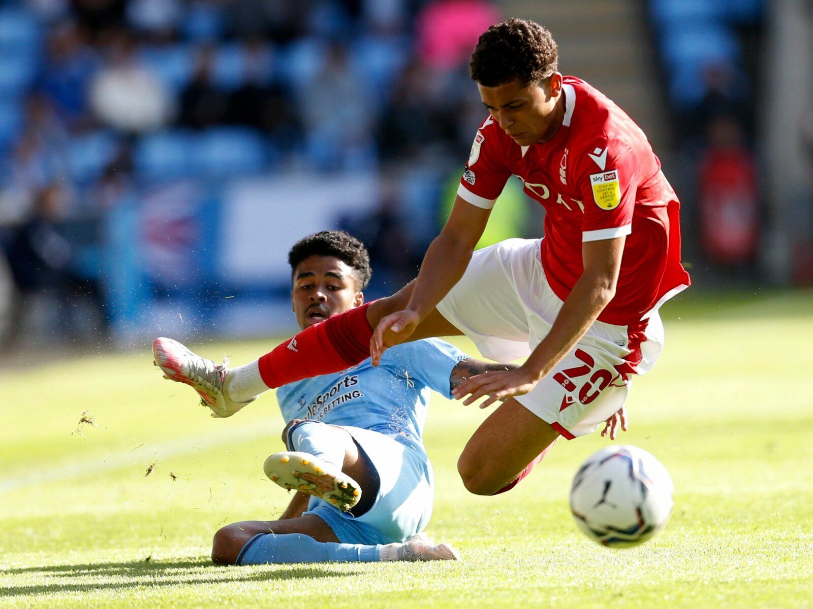 Soccer Football - Championship - Coventry City v Nottingham Forest - Coventry Building Society Arena, Coventry, Britain - August 8, 2021 Nottingham Forest's Brennan Johnson in action with Coventry City's Ian Maatsen Action Images/Ed Sykes