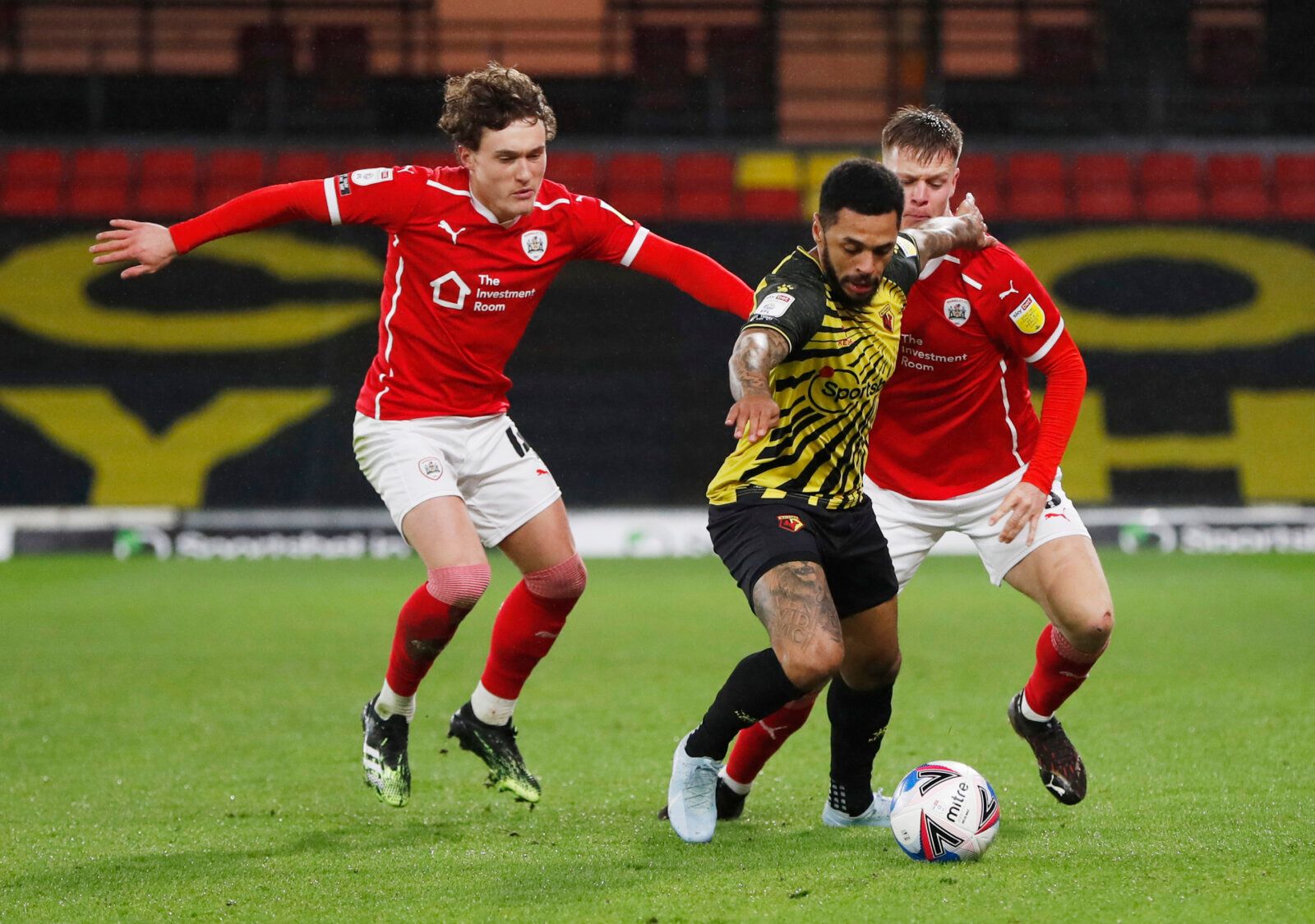 Soccer Football - Championship - Watford v Barnsley - Vicarage Road, Watford, Britain - January 19, 2021 Watford's Andre Gray in action with Barnsley's Mads Andersen and Callum Styles Action Images/Paul Childs EDITORIAL USE ONLY. No use with unauthorized audio, video, data, fixture lists, club/league logos or 'live' services. Online in-match use limited to 75 images, no video emulation. No use in betting, games or single club /league/player publications.  Please contact your account representati