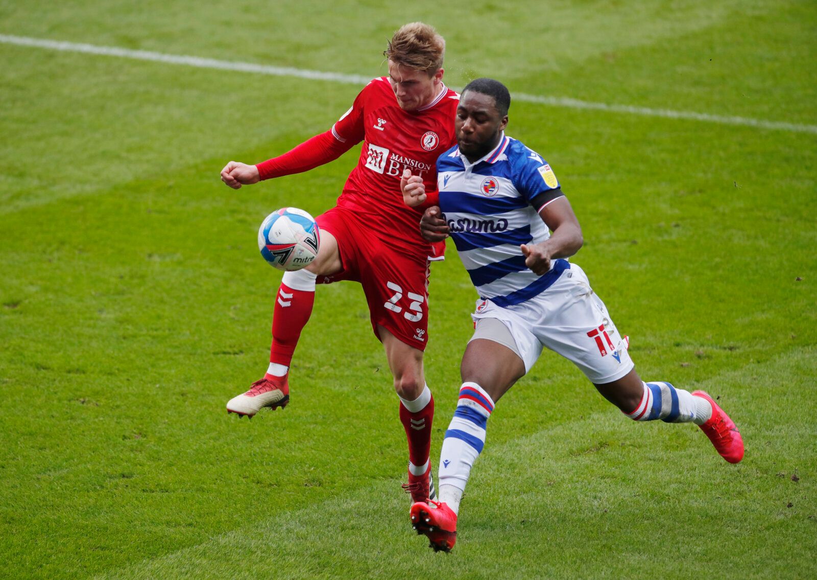 Soccer Football - Championship - Reading v Bristol City - Madejski Stadium, Reading, Britain - November 28, 2020 Reading's Yakou Meite in action with Bristol City's Taylor Moore Action Images/Andrew Couldridge EDITORIAL USE ONLY. No use with unauthorized audio, video, data, fixture lists, club/league logos or 'live' services. Online in-match use limited to 75 images, no video emulation. No use in betting, games or single club /league/player publications.  Please contact your account representati