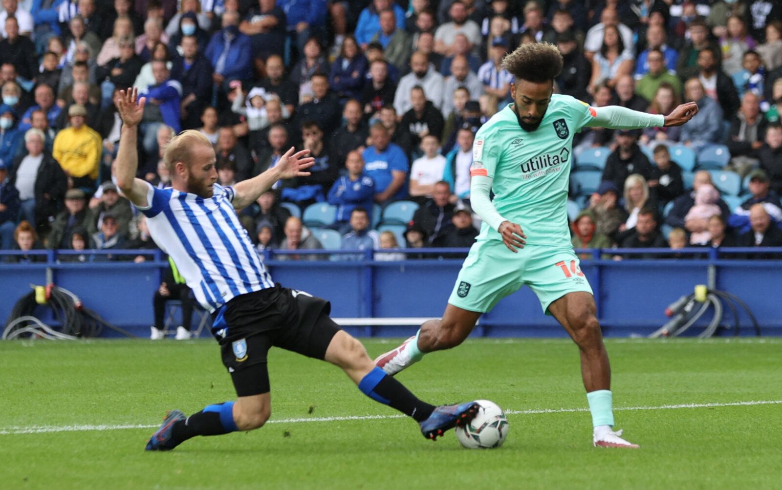 Soccer Football - Carabao Cup First Round - Sheffield Wednesday v Huddersfield Town - Hillsborough, Sheffield, Britain - August 1, 2021 Sheffield Wednesday's Barry Bannan in action with Huddersfield Town's Sorba Thomas Action Images/Lee Smith