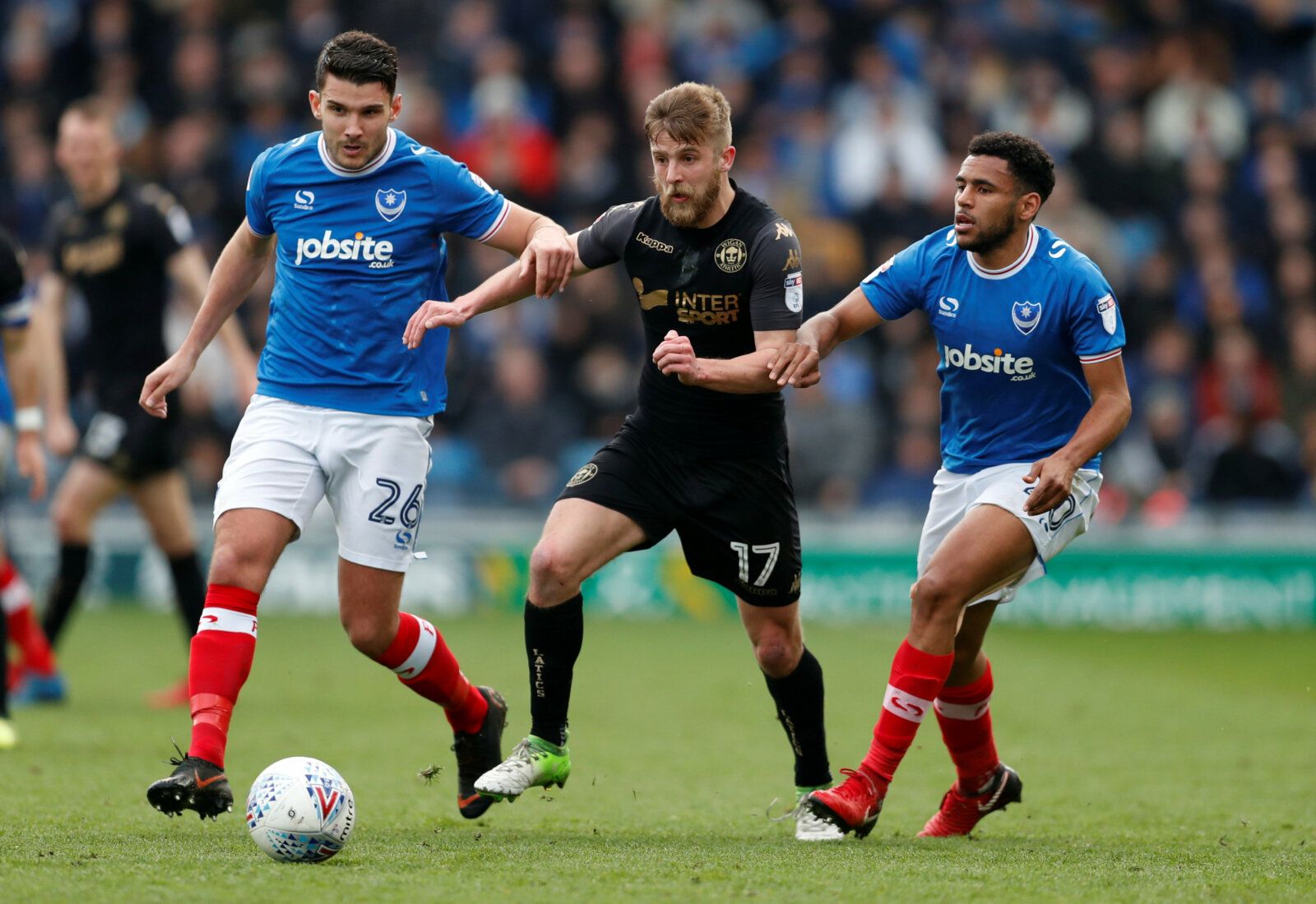 Soccer Football - League One - Portsmouth vs Wigan Athletic - Fratton Park, Portsmouth, Britain - April 2, 2018   Portsmouth’s Gareth Evans (L) and Nathan Thompson (R) in action with Wigan’s Michael Jacobs   Action Images/Matthew Childs    EDITORIAL USE ONLY. No use with unauthorized audio, video, data, fixture lists, club/league logos or 
