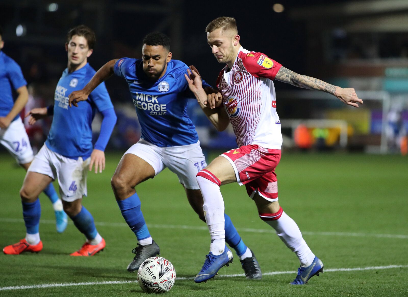 Soccer Football - FA Cup First Round Replay - Peterborough United v Stevenage - Weston Homes Stadium, Peterborough, Britain - November 19, 2019   Stevenage's Charlie Lakin in action with Peterborough United's Nathan Thompson   Action Images/Molly Darlington