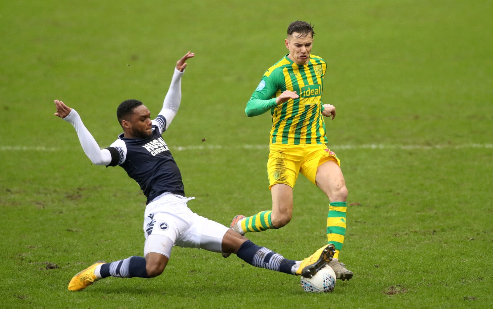 Soccer Football - Championship - Millwall v West Bromwich Albion - The Den, London, Britain - February 9, 2020   Millwall's Mahlon Romeo in action with West Bromwich Albion's Conor Townsend   Action Images/Peter Cziborra    EDITORIAL USE ONLY. No use with unauthorized audio, video, data, fixture lists, club/league logos or 