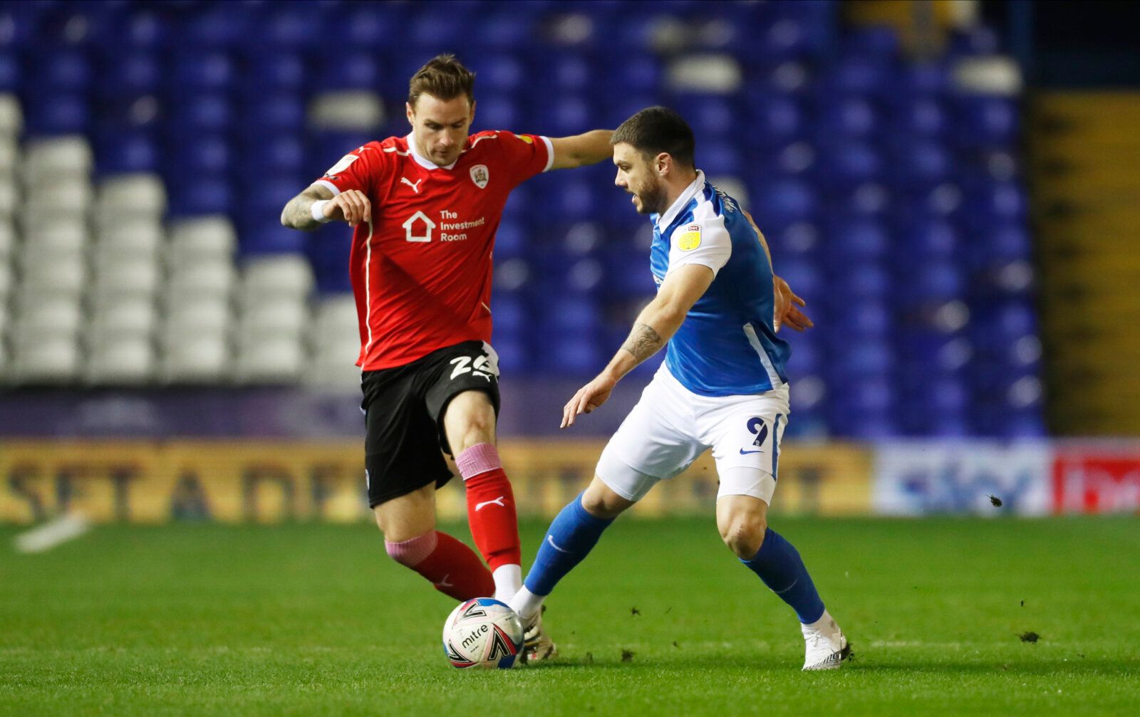 Soccer Football - Championship - Birmingham City v Barnsley - St Andrew's, Birmingham, Britain - December 1, 2020 Birmingham City's Scott Hogan in action with Barnsley's Michael Sollbauer Action Images/Matthew Childs EDITORIAL USE ONLY. No use with unauthorized audio, video, data, fixture lists, club/league logos or 'live' services. Online in-match use limited to 75 images, no video emulation. No use in betting, games or single club /league/player publications.  Please contact your account repre