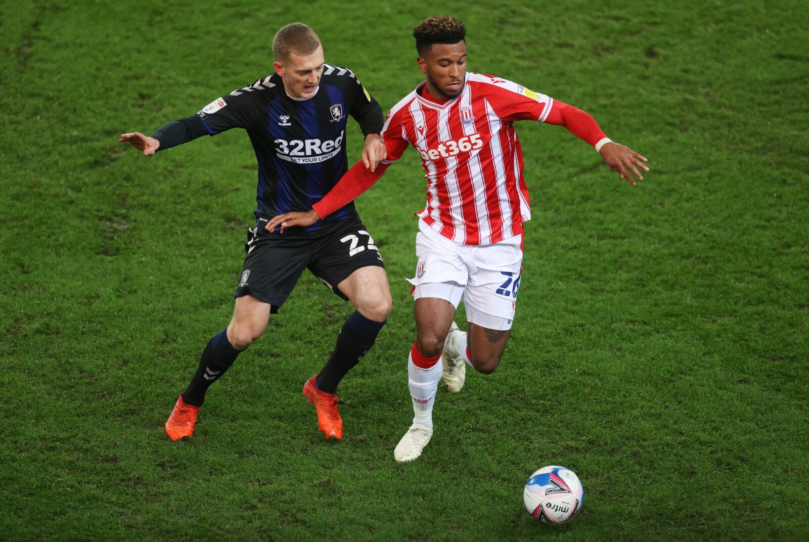 Soccer Football - Championship - Stoke City v Middlesbrough - bet365 Stadium, Stoke-on-Trent, Britain - December 5, 2020 Stoke City's Tyrese Campbell in action with Middlesbrough's George Saville Action Images/Carl Recine EDITORIAL USE ONLY. No use with unauthorized audio, video, data, fixture lists, club/league logos or 'live' services. Online in-match use limited to 75 images, no video emulation. No use in betting, games or single club /league/player publications.  Please contact your account 