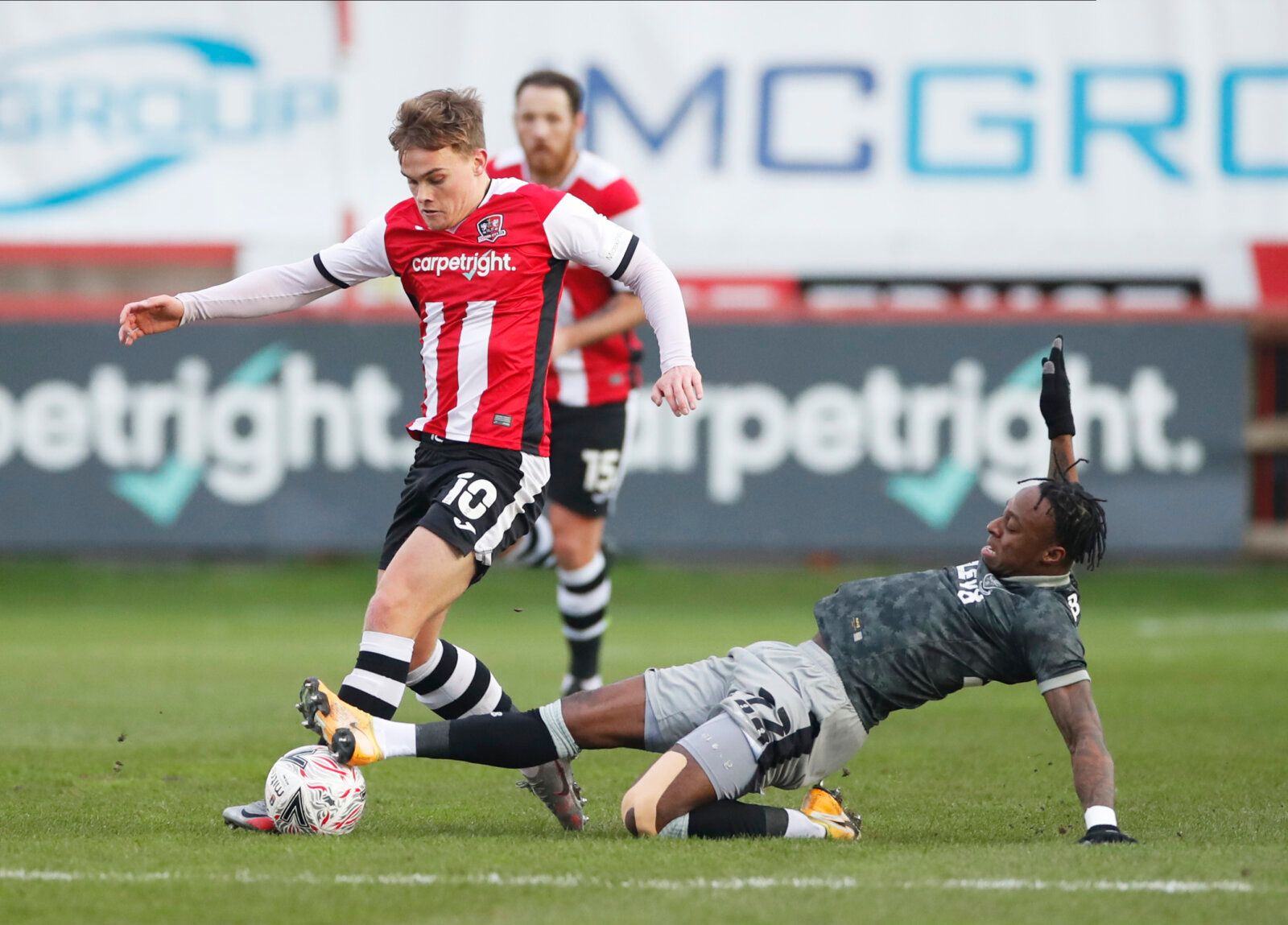 Soccer Football - FA Cup - Third Round - Exeter City v Sheffield Wednesday - St James Park, Exeter, Britain - January 9, 2021  Exeter City's Archie Collins in action with Sheffield Wednesday's Moses Odubajo Action Images via Reuters/Paul Childs