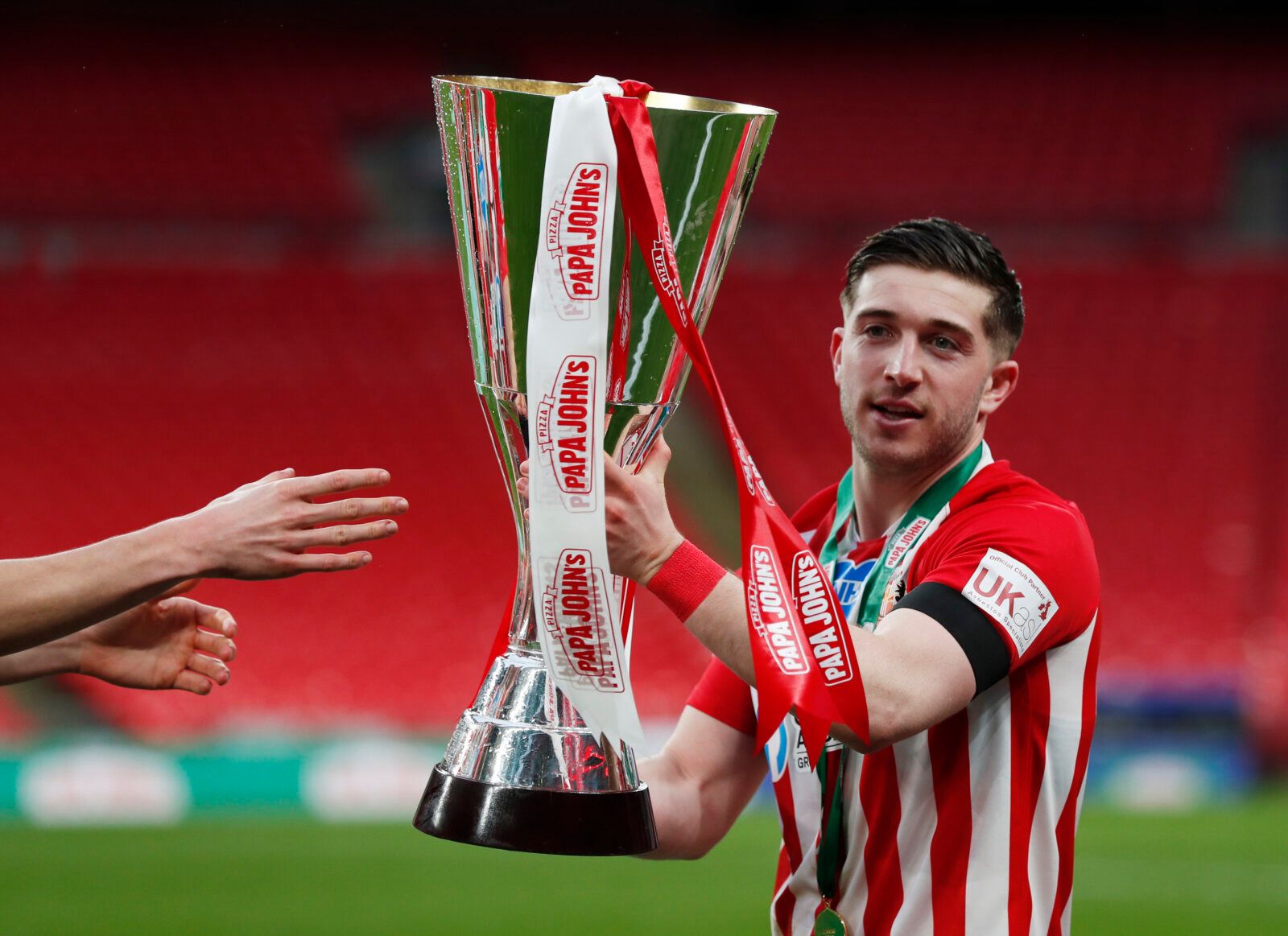 Soccer Football - EFL Trophy Final - Sunderland v Tranmere Rovers - Wembley Stadium, London, Britain - March 14, 2021 Sunderland's Lynden Gooch celebrates with the EFL Trophy after the match Action Images/Lee Smith EDITORIAL USE ONLY. No use with unauthorized audio, video, data, fixture lists, club/league logos or 'live' services. Online in-match use limited to 75 images, no video emulation. No use in betting, games or single club /league/player publications.  Please contact your account represe