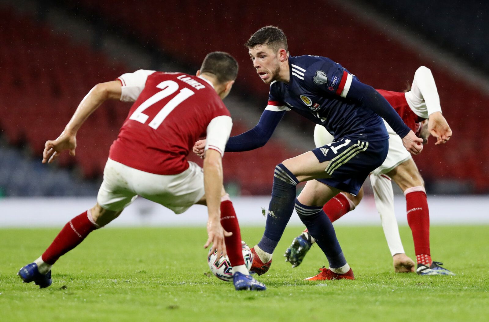 Soccer Football - World Cup Qualifiers Europe - Group F - Scotland v Austria - Hampden Park, Glasgow, Scotland, Britain - March 25, 2021 Austria's Stefan Lainer in action with Scotland's Ryan Christie REUTERS/Russell Cheyne