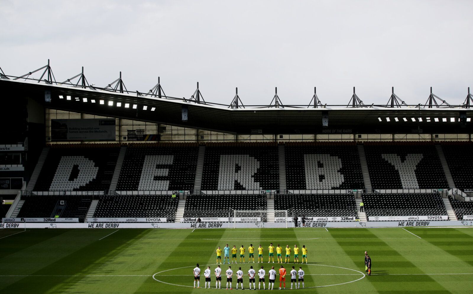 Soccer Football - Championship - Derby County v Norwich City - Pride Park, Derby, Britain - April 10, 2021 General view of players during a two minute silence after Britain's Prince Philip, husband of Queen Elizabeth, died at the age of 99 Action Images via Reuters/Carl Recine EDITORIAL USE ONLY. No use with unauthorized audio, video, data, fixture lists, club/league logos or 'live' services. Online in-match use limited to 75 images, no video emulation. No use in betting, games or single club /l