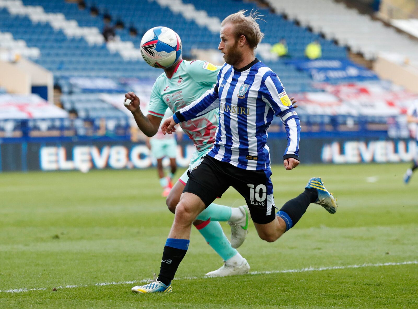 Soccer Football - Championship - Sheffield Wednesday v Swansea City - Hillsborough, Sheffield, Britain - April 13, 2021 Sheffield Wednesday's Barry Bannan in action with Swansea City's Andre Ayew Action Images/Andrew Boyers EDITORIAL USE ONLY. No use with unauthorized audio, video, data, fixture lists, club/league logos or 'live' services. Online in-match use limited to 75 images, no video emulation. No use in betting, games or single club /league/player publications.  Please contact your accoun