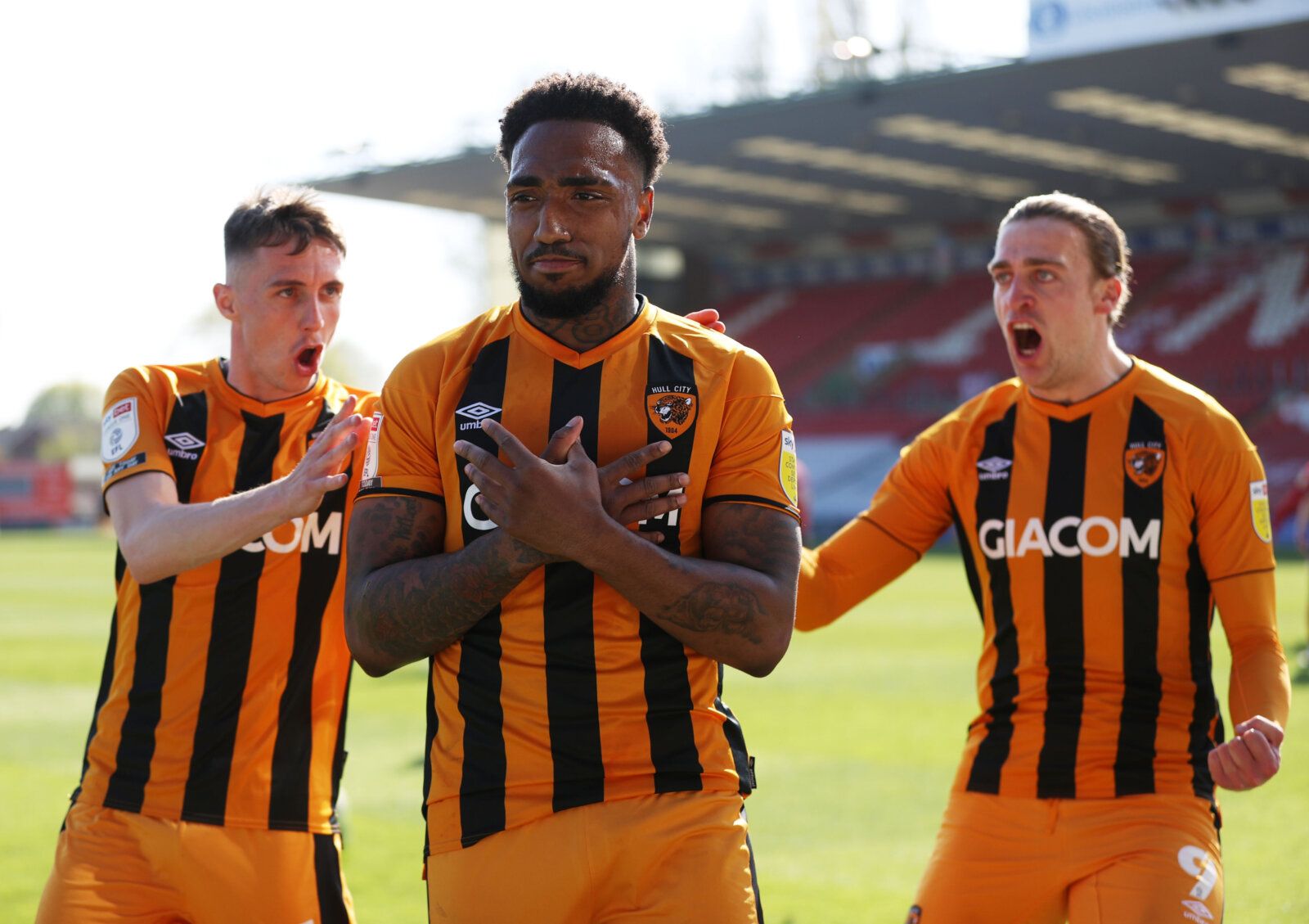Soccer Football - League One - Lincoln City v Hull City - Sincil Bank, Lincoln, Britain - April 24, 2021 Hull City's Mallik Wilks celebrates after scoring their second goal with teammates Action Images/Molly Darlington EDITORIAL USE ONLY. No use with unauthorized audio, video, data, fixture lists, club/league logos or 'live' services. Online in-match use limited to 75 images, no video emulation. No use in betting, games or single club /league/player publications.  Please contact your account rep