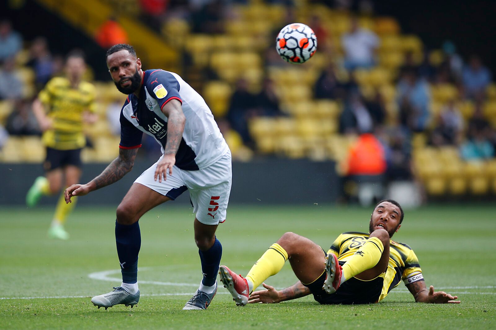 Soccer Football - Pre Season Friendly - Watford v West Bromwich Albion - Vicarage Road, Watford, Britain - July 24, 2021 Watford's Troy Deeney in action West Bromwich Albion's Kyle Bartley Action Images via Reuters/Paul Childs