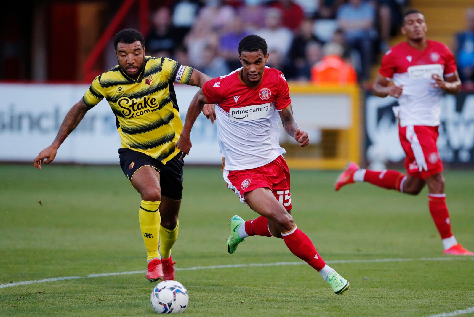 Soccer Football - Pre Season Friendly - Stevenage v Watford - The Lamex Stadium, Stevenage, Britain - July 27, 2021  Watford's Troy Deeney in action with Stevenage's Terence Vancooten Action Images via Reuters/Andrew Couldridge