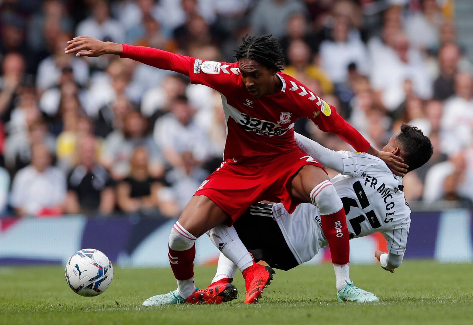 Soccer Football - Championship - Fulham v Middlesbrough - Craven Cottage, London, Britain - August 8, 2021 Middlesbrough's Djed Spence in action with Fulham’s Tyrese Francois Action Images/Andrew Couldridge