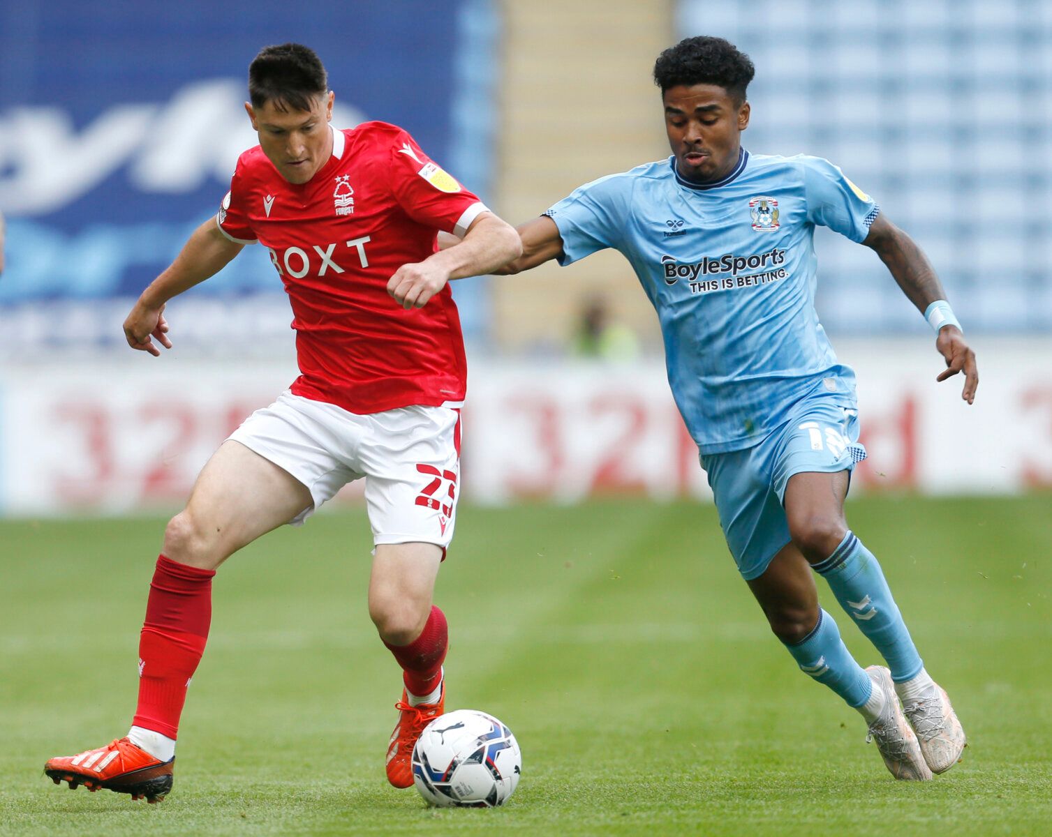 Soccer Football - Championship - Coventry City v Nottingham Forest - Coventry Building Society Arena, Coventry, Britain - August 8, 2021 Nottingham Forest's Joe Lolley and Coventry City's Ian Maatsen in action Action Images/Ed Sykes