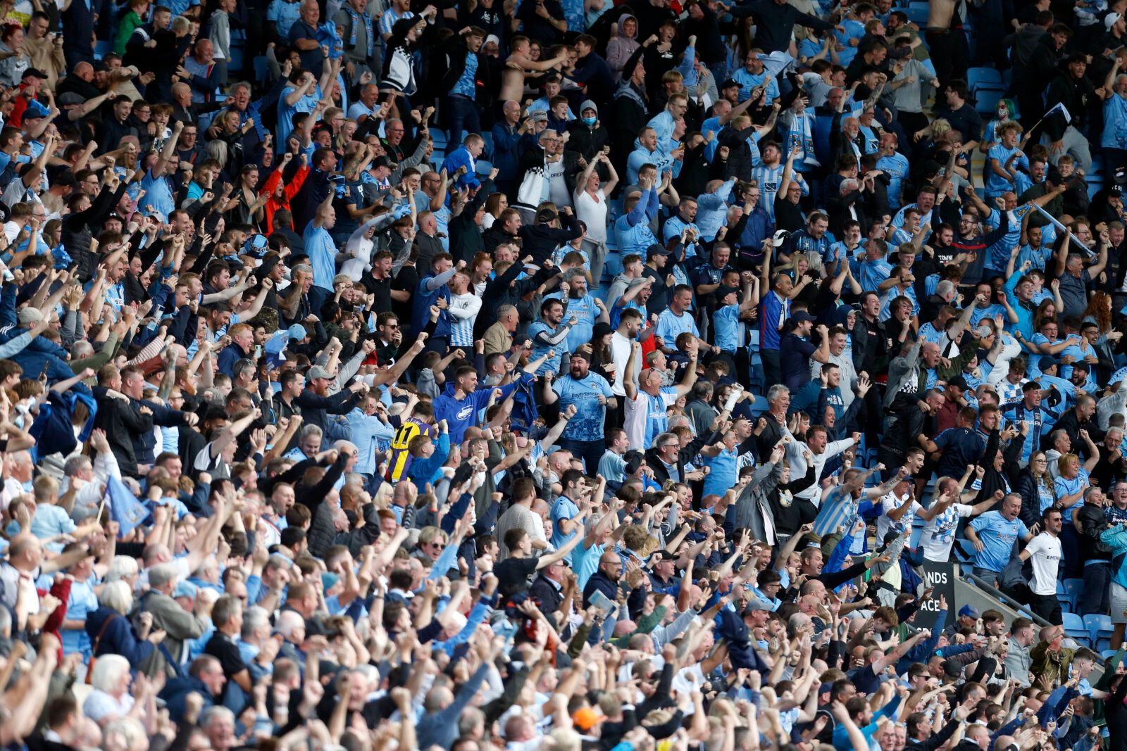 Soccer Football - Championship - Coventry City v Nottingham Forest - Coventry Building Society Arena, Coventry, Britain - August 8, 2021 Coventry City fans celebrate their second goal Action Images/Ed Sykes