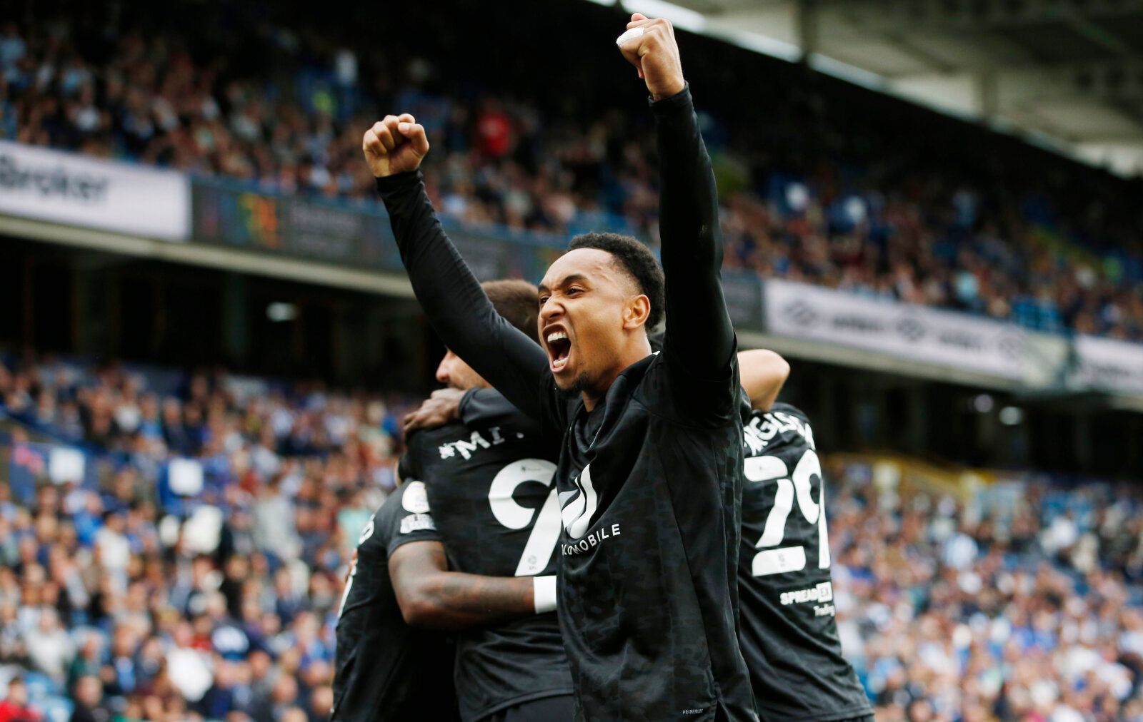 Soccer Football - Championship - Huddersfield Town v Fulham - John Smith's Stadium, Huddersfield, Britain - August 14, 2021 Fulham's Kenny Tete celebrates their fourth goal, scored by Ivan Cavaleiro Action Images/Craig Brough EDITORIAL USE ONLY. No use with unauthorized audio, video, data, fixture lists, club/league logos or 'live' services. Online in-match use limited to 75 images, no video emulation. No use in betting, games or single club /league/player publications.  Please contact your acco