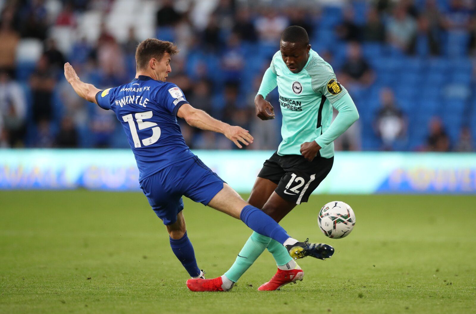 Soccer - England - Carabao Cup Second Round - Cardiff City v Brighton &amp; Hove Albion - Cardiff City Stadium, Cardiff, Britain - August 24, 2021 Brighton &amp; Hove Albion's Enock Mwepu in action with Cardiff City's Ryan Wintle Action Images via Reuters/Peter Cziborra