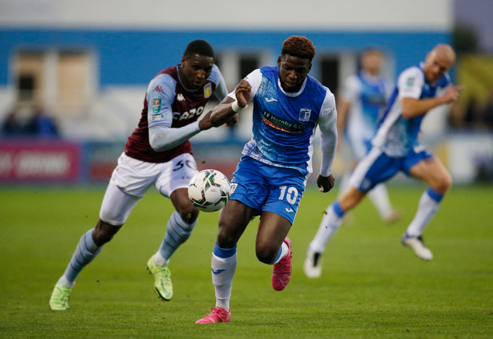 Soccer - England - Carabao Cup Second Round - Barrow v Aston Villa - Holker Street, Barrow-in-Furness, Britain - August 24, 2021 Aston Villa's Kortney Hause in action with Barrow's Offrande Zanzala Action Images via Reuters/Ed Sykes