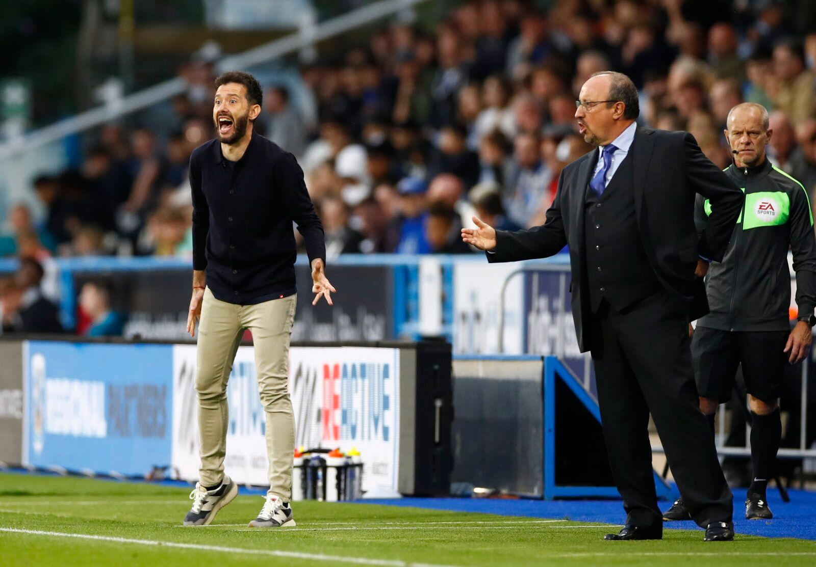 Soccer - England - Carabao Cup Second Round - Huddersfield Town v Everton - John Smith's Stadium, Huddersfield, Britain - August 24, 2021 Everton manager Rafael Benitez and Huddersfield Town manager Carlos Corberan react during the match Action Images via Reuters/Jason Cairnduff
