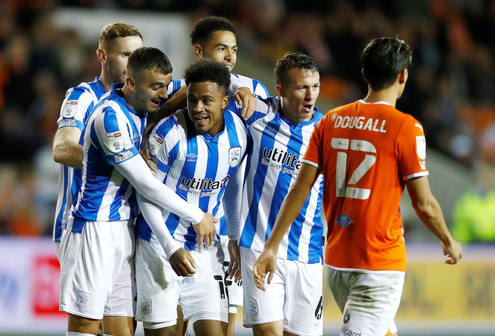 Soccer Football - Championship - Blackpool v Huddersfield Town - Bloomfield Road, Blackpool, Britain - September 14, 2021 Huddersfield Town's Josh Koroma celebrates scoring their first goal with teammates  Action Images/Jason Cairnduff