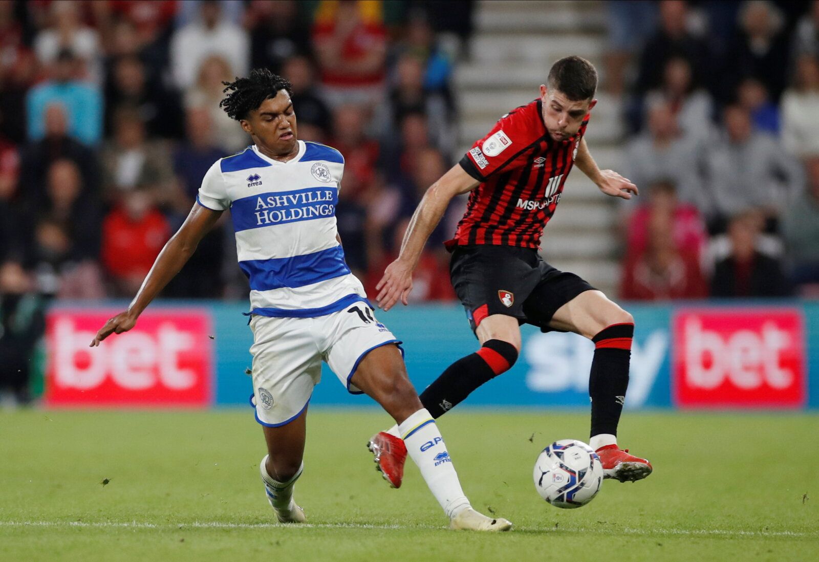 Soccer Football - Championship - AFC Bournemouth v Queens Park Rangers - Vitality Stadium, Bournemouth, Britain - September 14, 2021 Queens Park Rangers' Sam McCallum in action with AFC Bournemouth's Ryan Christie Action Images/Paul Childs