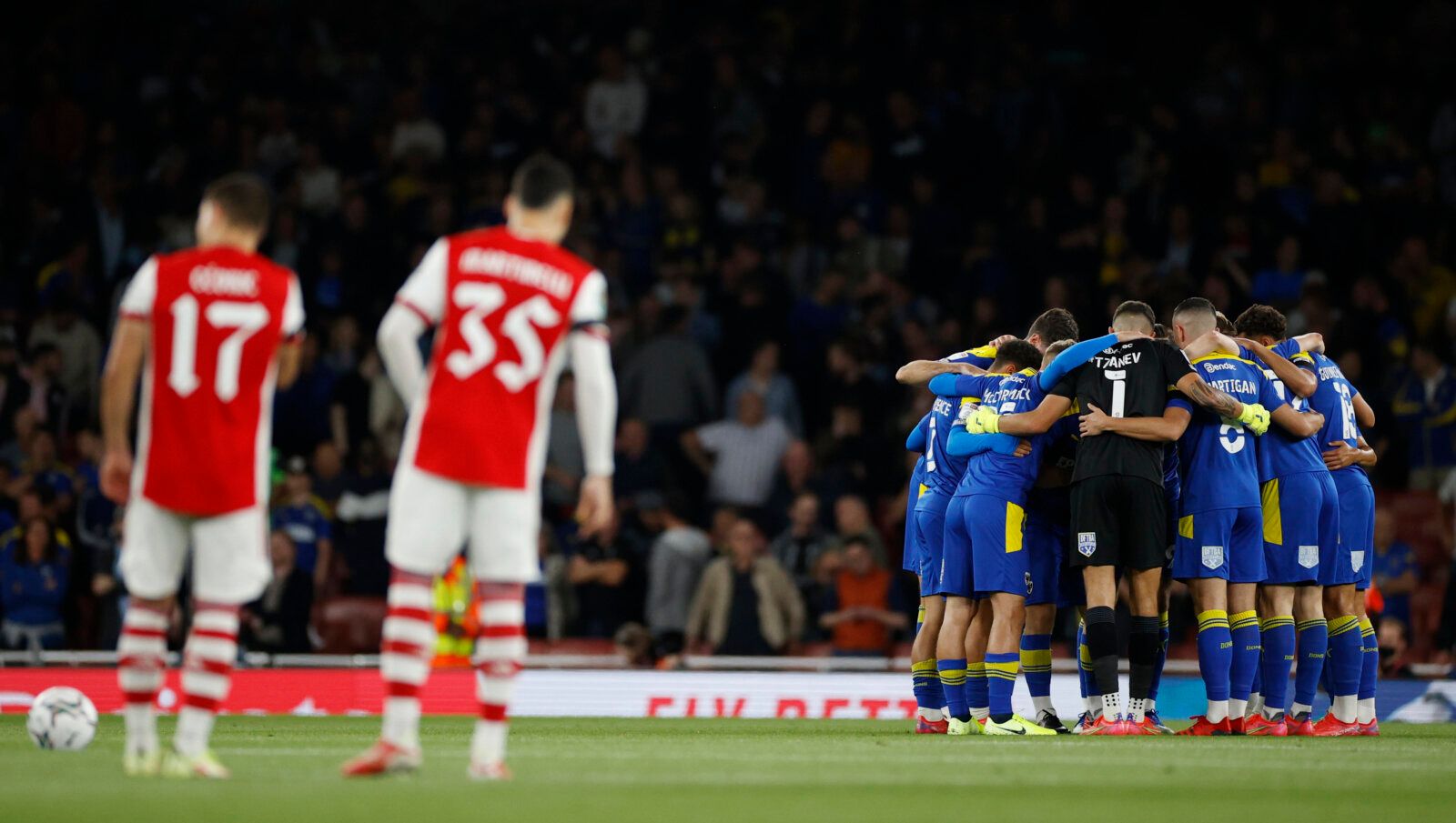 Soccer Football - Carabao Cup - Third Round - Arsenal v AFC Wimbledon - Emirates Stadium, London, Britain - September 22, 2021 AFC Wimbledon team huddle before the match Action Images via Reuters/John Sibley EDITORIAL USE ONLY. No use with unauthorized audio, video, data, fixture lists, club/league logos or 'live' services. Online in-match use limited to 75 images, no video emulation. No use in betting, games or single club /league/player publications.  Please contact your account representative