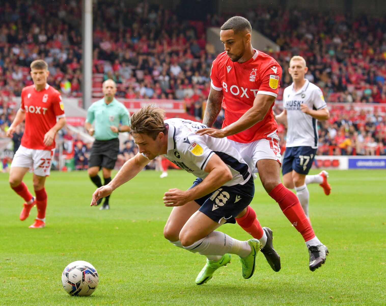 Soccer Football - Championship - Nottingham Forest v Millwall - The City Ground, Nottingham, Britain - September 25, 2021 Nottingham Forest's Max Lowe in action with Millwall's Ryan Leonard. Action Images/Paul Burrows    EDITORIAL USE ONLY. No use with unauthorized audio, video, data, fixture lists, club/league logos or 