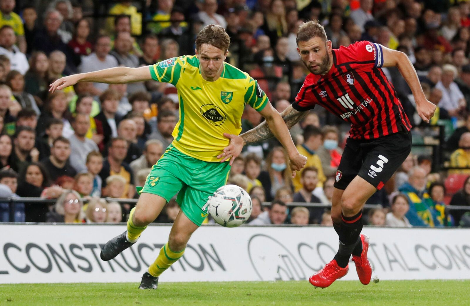 Soccer - England - Carabao Cup Second Round - Norwich City v AFC Bournemouth - Carrow Road, Norwich, Britain - August 24, 2021 Norwich City's Kieran Dowell in action with AFC Bournemouth's Steve Cook Action Images via Reuters/Matthew Childs