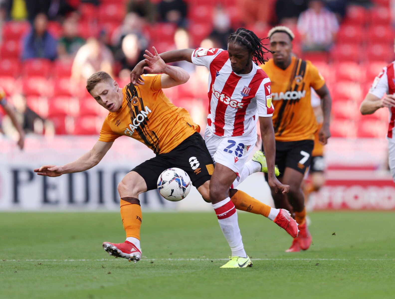 Soccer Football - England - Championship - Stoke City v Hull City - bet365 Stadium, Stoke-on-Trent, Britain - September 25, 2021  Hull City's Greg Docherty in action with Stoke City's Romaine Sawyers  Action Images/John Clifton   EDITORIAL USE ONLY. No use with unauthorized audio, video, data, fixture lists, club/league logos or 