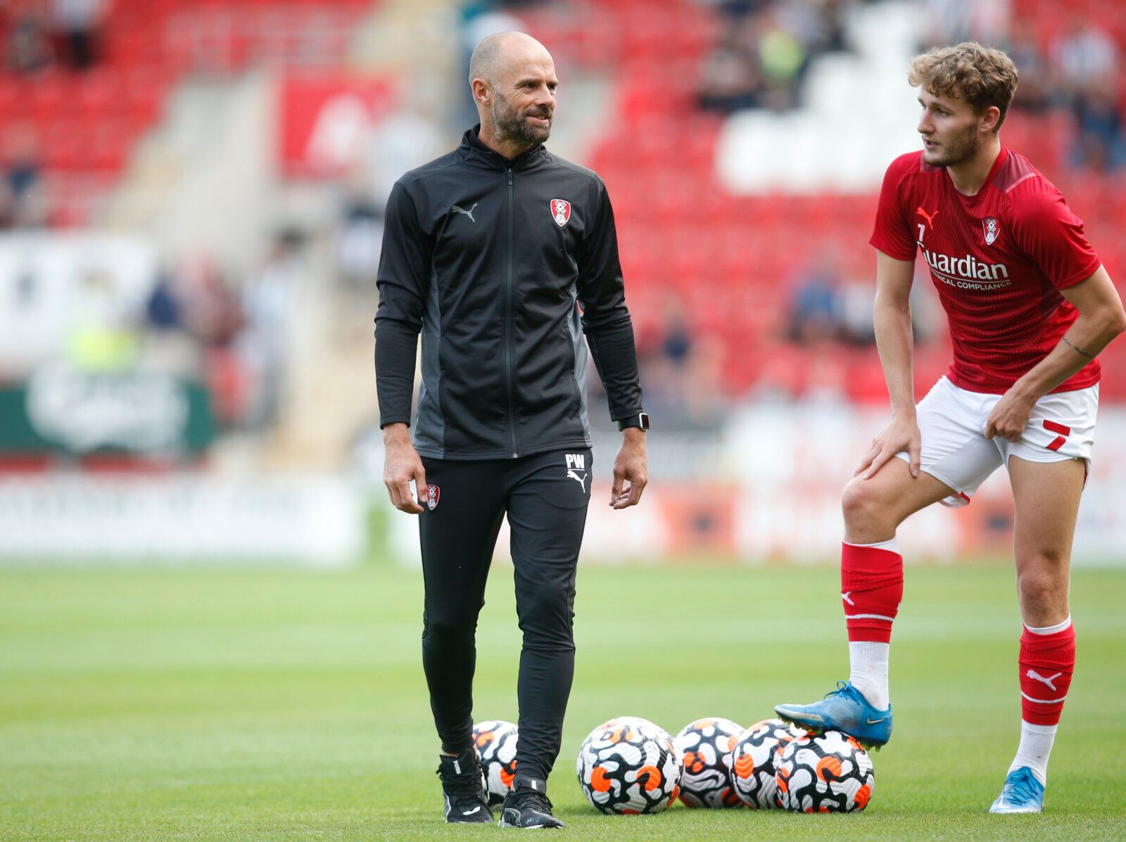 Soccer Football - Pre Season Friendly - Rotherham United v Newcastle United - AESSEAL New York Stadium, Rotherham, Britain - July 27, 2021 Rotherham United manager Paul Warne with Kieran Sadlier before the match Action Images via Reuters/Ed Sykes