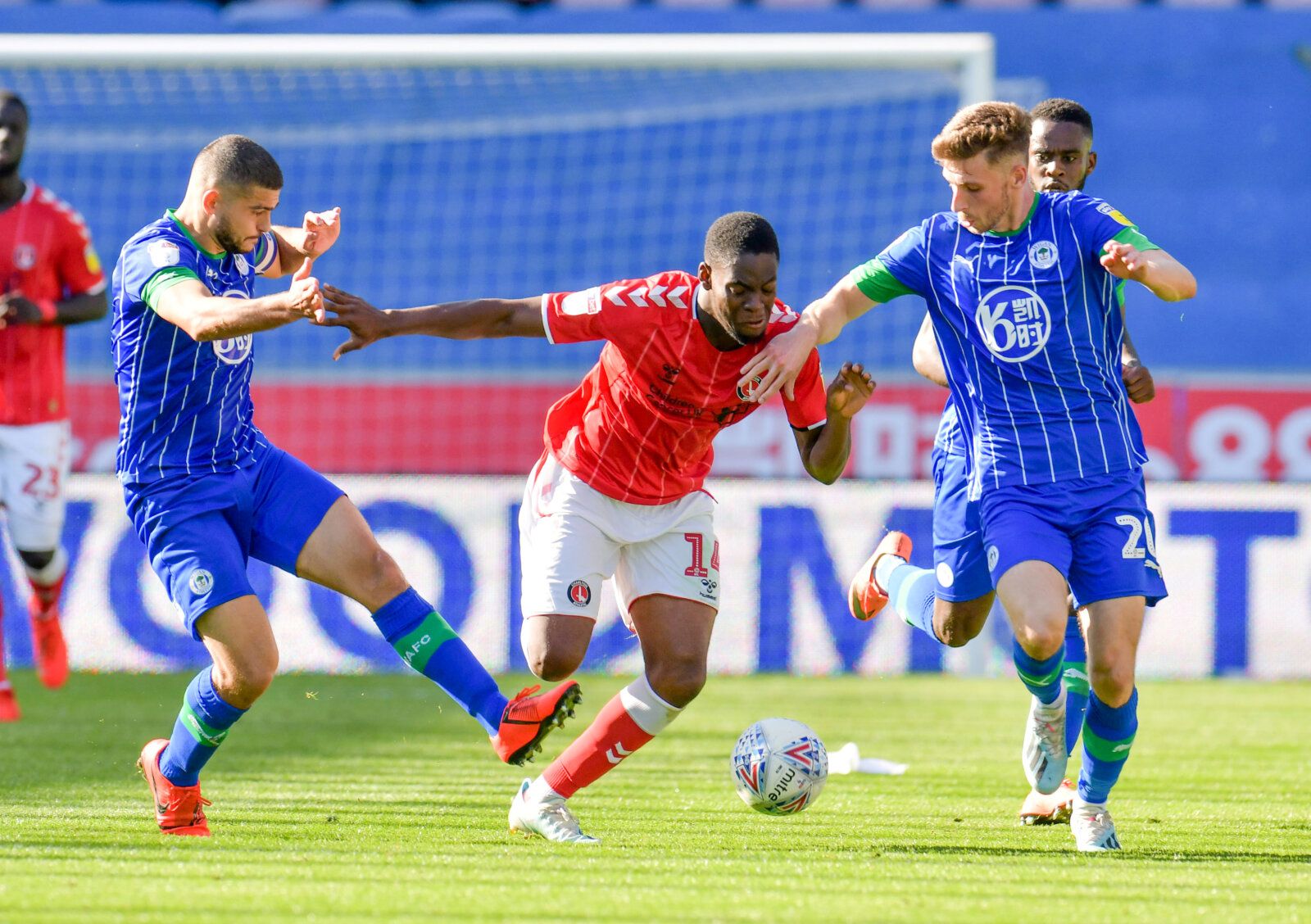 Soccer Football - Championship - Wigan Athletic v Charlton Athletic - DW Stadium, Wigan, Britain - September 21, 2019   Charlton Athletic's Jonathan Leko in action with Wigan Athletic's Sam Morsy and Joe Williams   Action Images/Paul Burrows    EDITORIAL USE ONLY. No use with unauthorized audio, video, data, fixture lists, club/league logos or 