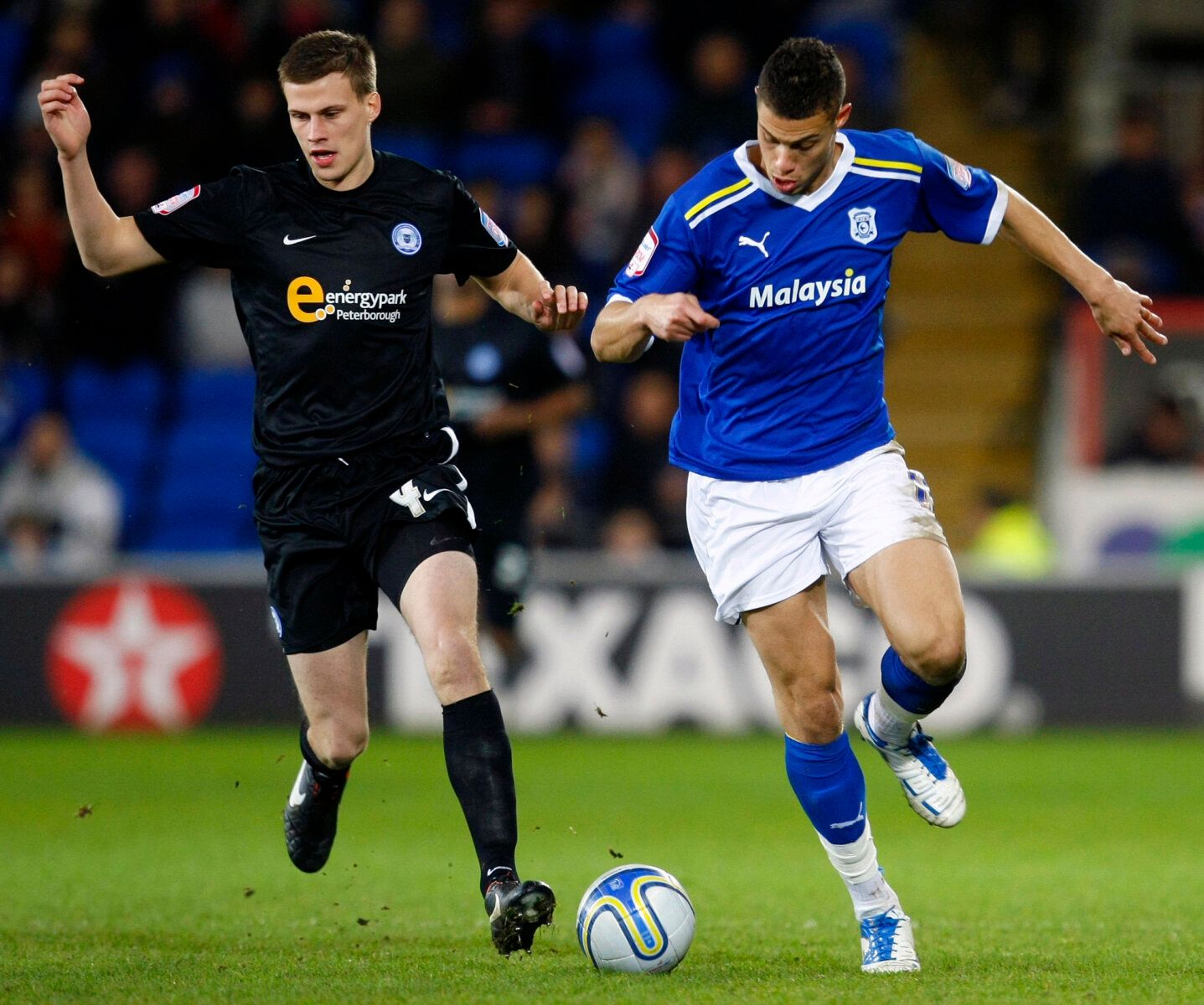 Football - Cardiff City v Peterborough United npower Football League Championship  - Cardiff City Stadium  - 14/2/12 
Peterborough United's Ryan Bennett (L) in action with Cardiff City's Rudy Gestede   
Mandatory Credit: Action Images / James Benwell 
Livepic 
EDITORIAL USE ONLY. No use with unauthorized audio, video, data, fixture lists, club/league logos or live services. Online in-match use limited to 45 images, no video emulation. No use in betting, games or single club/league/player publica