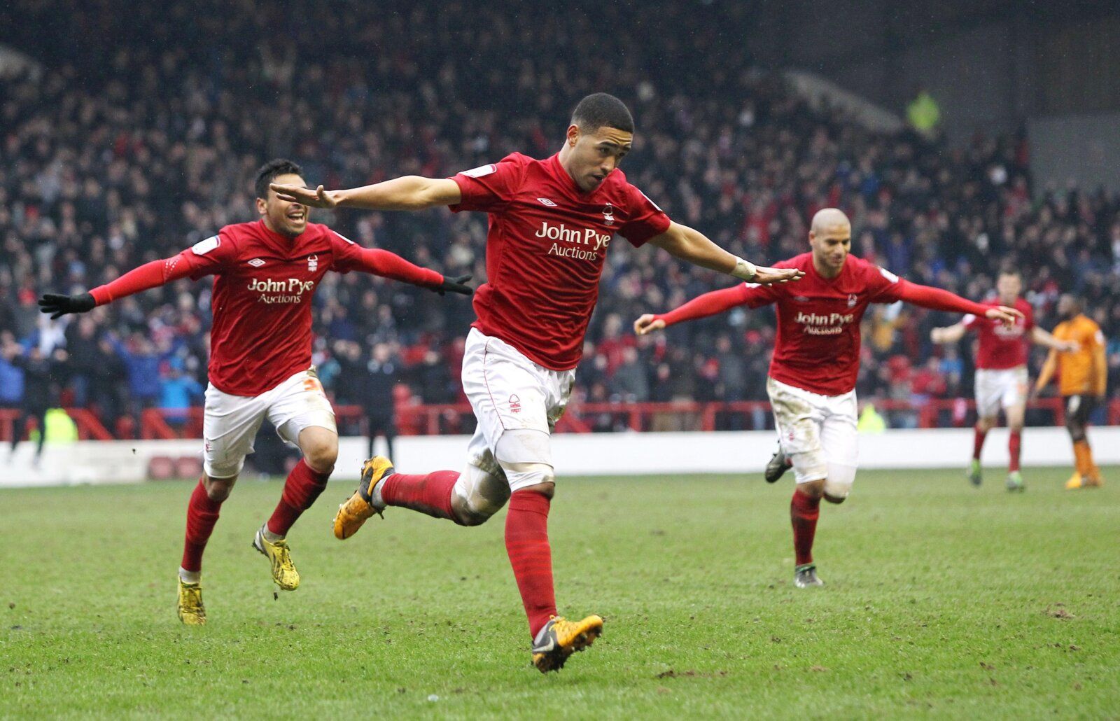 Football - Nottingham Forest v Wolverhampton Wanderers - npower Football League Championship - The City Ground  - 9/3/13 
Lewis McGugan (C) celebrates after scoring the third goal for Nottingham Forest 
Mandatory Credit: Action Images / Ed Sykes 
Livepic 
EDITORIAL USE ONLY. No use with unauthorized audio, video, data, fixture lists, club/league logos or live services. Online in-match use limited to 45 images, no video emulation. No use in betting, games or single club/league/player publications