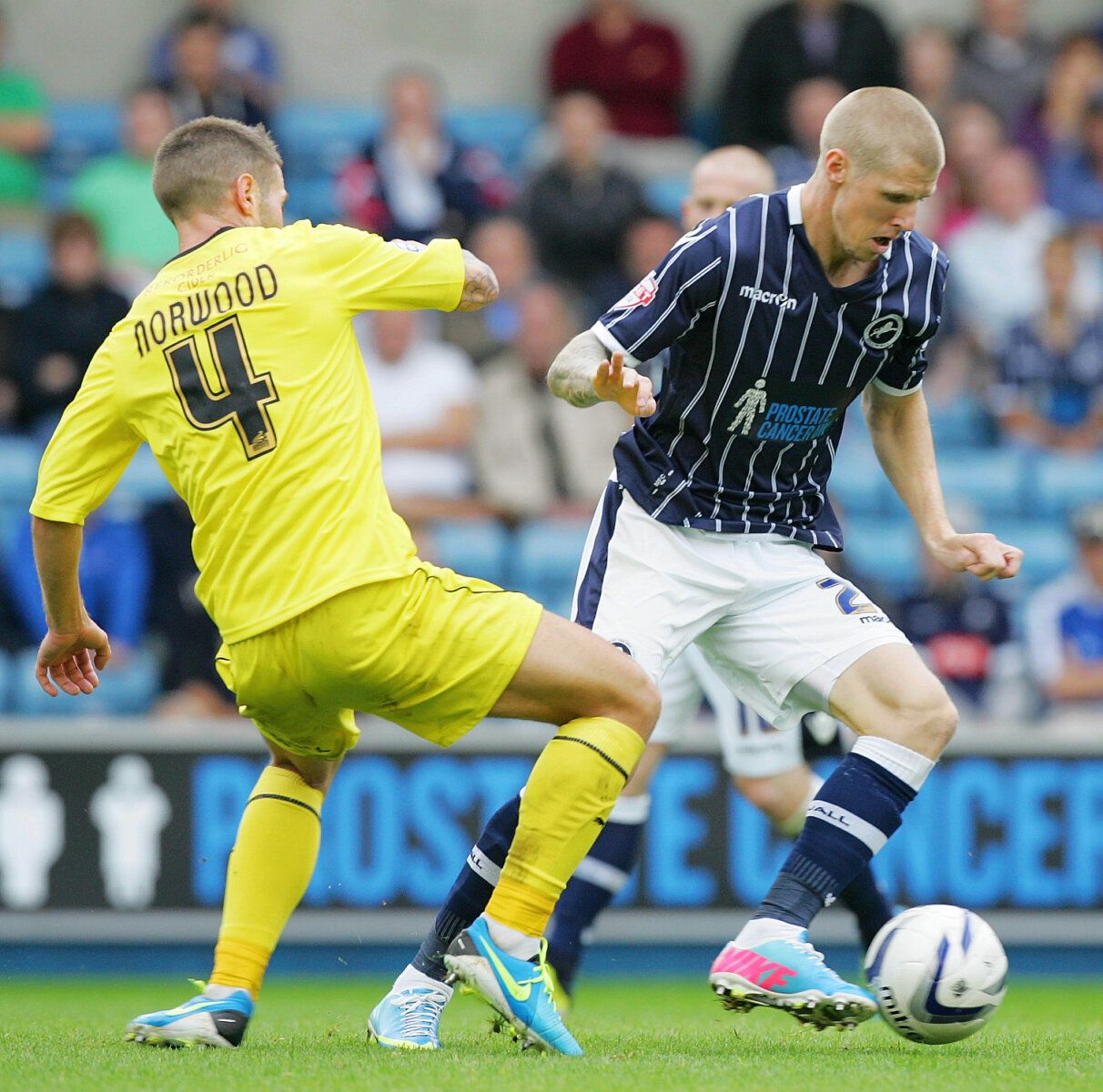 Football - Millwall v Huddersfield Town - Sky Bet Football League Championship - The New Den - 17/8/13 
Millwall's Andy Keogh (R) and Huddersfield's Oliver Norwood in action 
Mandatory Credit: Action Images / David Field 
Livepic 
EDITORIAL USE ONLY. No use with unauthorized audio, video, data, fixture lists, club/league logos or live services. Online in-match use limited to 45 images, no video emulation. No use in betting, games or single club/league/player publications.  Please contact your ac
