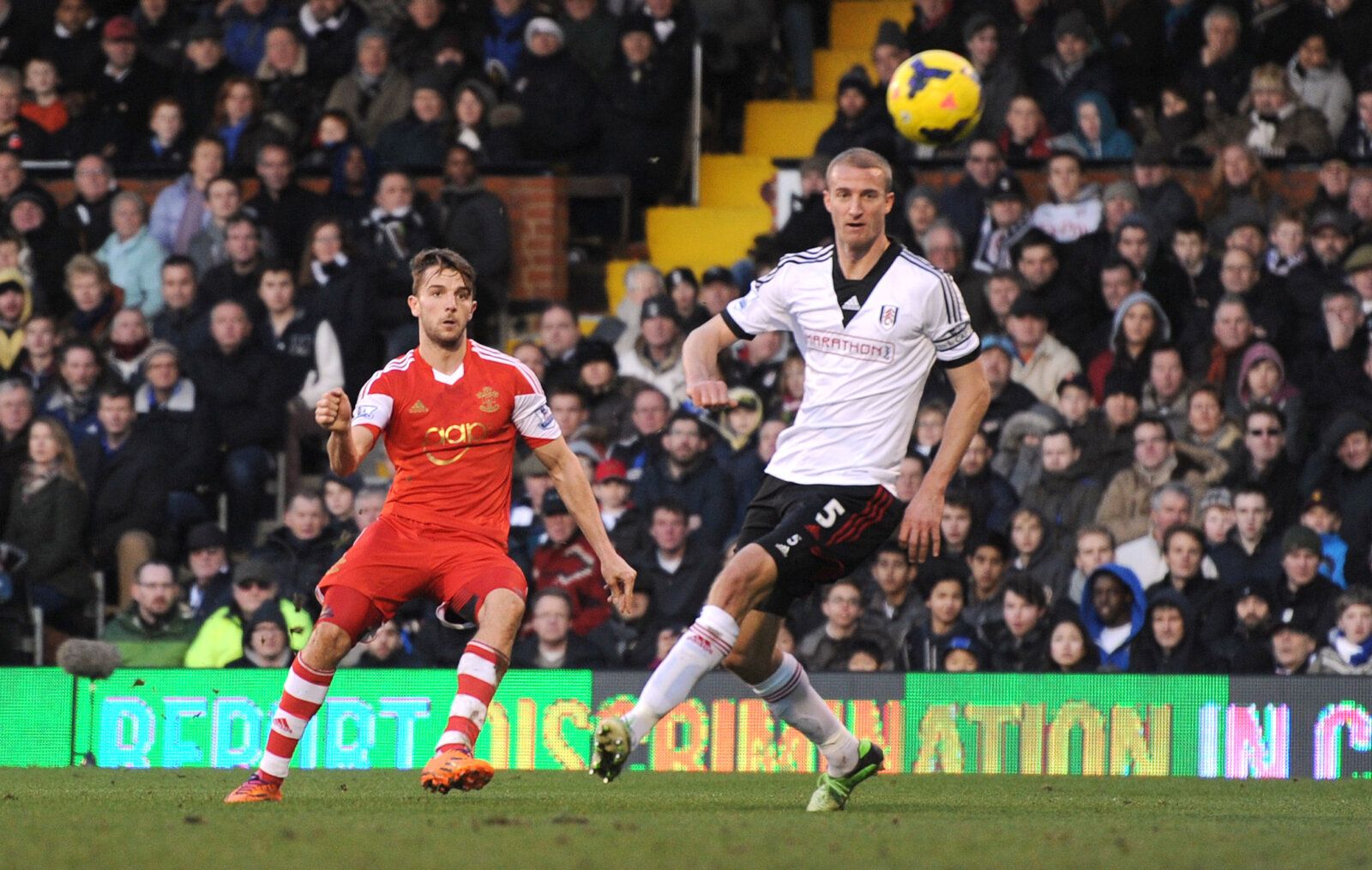 Football - Fulham v Southampton - Barclays Premier League - Craven Cottage - 1/2/14 
Southampton's Jay Rodriguez (L) scores their third goal as Fulham's Brede Hangeland looks on 
Mandatory Credit: Action Images / Tony O'Brien 
Livepic 
EDITORIAL USE ONLY. No use with unauthorized audio, video, data, fixture lists, club/league logos or live services. Online in-match use limited to 45 images, no video emulation. No use in betting, games or single club/league/player publications.  Please contact yo