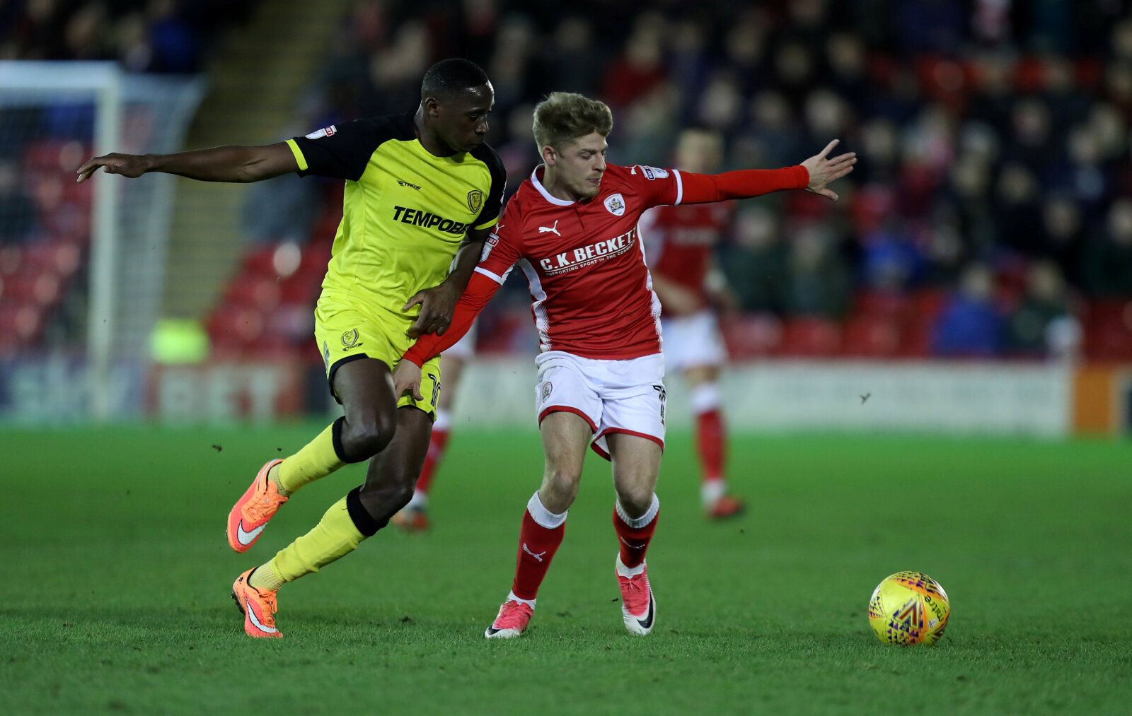 Soccer Football - Championship - Barnsley vs Burton Albion - Oakwell, Barnsley, Britain - February 20, 2018  BarnsleyÕs Lloyd Isgrove in action with Burton AlbionÕs Lucas Akins  Action Images/John Clifton  EDITORIAL USE ONLY. No use with unauthorized audio, video, data, fixture lists, club/league logos or 