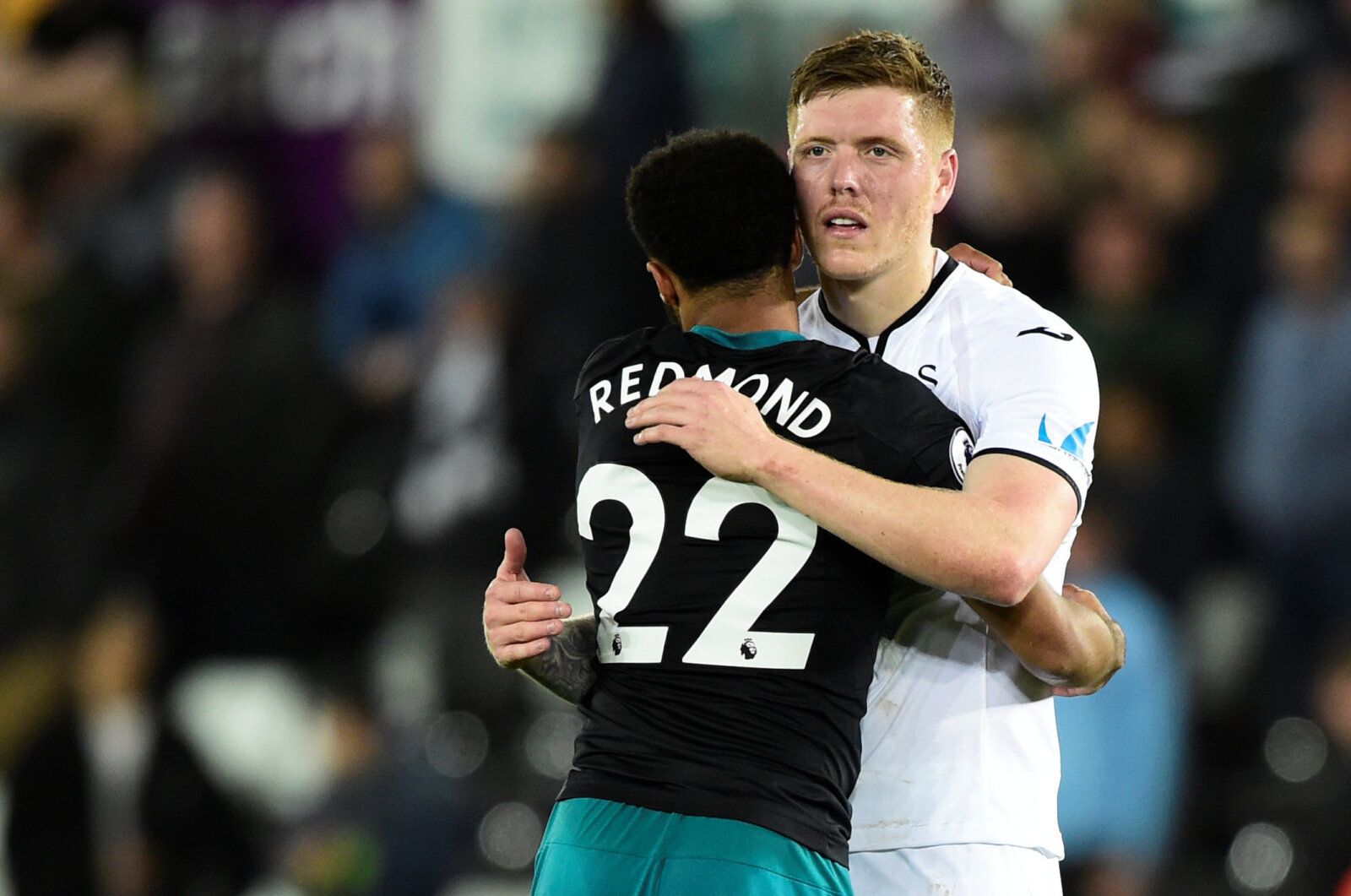 Soccer Football - Premier League - Swansea City v Southampton - Liberty Stadium, Swansea, Britain - May 8, 2018   Swansea City's Alfie Mawson hugs Southampton's Nathan Redmond after the match   REUTERS/Rebecca Naden    EDITORIAL USE ONLY. No use with unauthorized audio, video, data, fixture lists, club/league logos or 