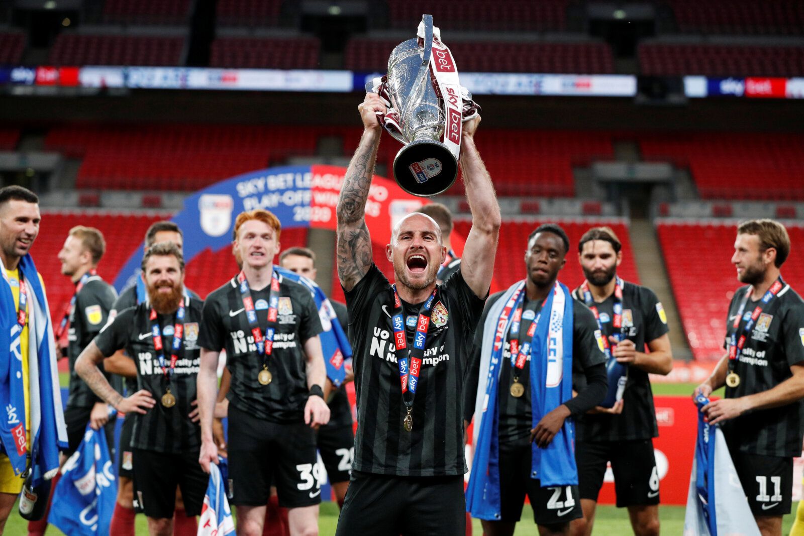 Soccer Football - League Two Play-Off Final - Exeter City v Northampton Town - Wembley Stadium, London, Britain - June 29, 2020   Northampton Town's Alan McCormack celebrates with the trophy after winning the League Two Play-Off Final, as play resumes behind closed doors following the outbreak of the coronavirus disease (COVID-19)   Action Images/John Sibley    EDITORIAL USE ONLY. No use with unauthorized audio, video, data, fixture lists, club/league logos or 