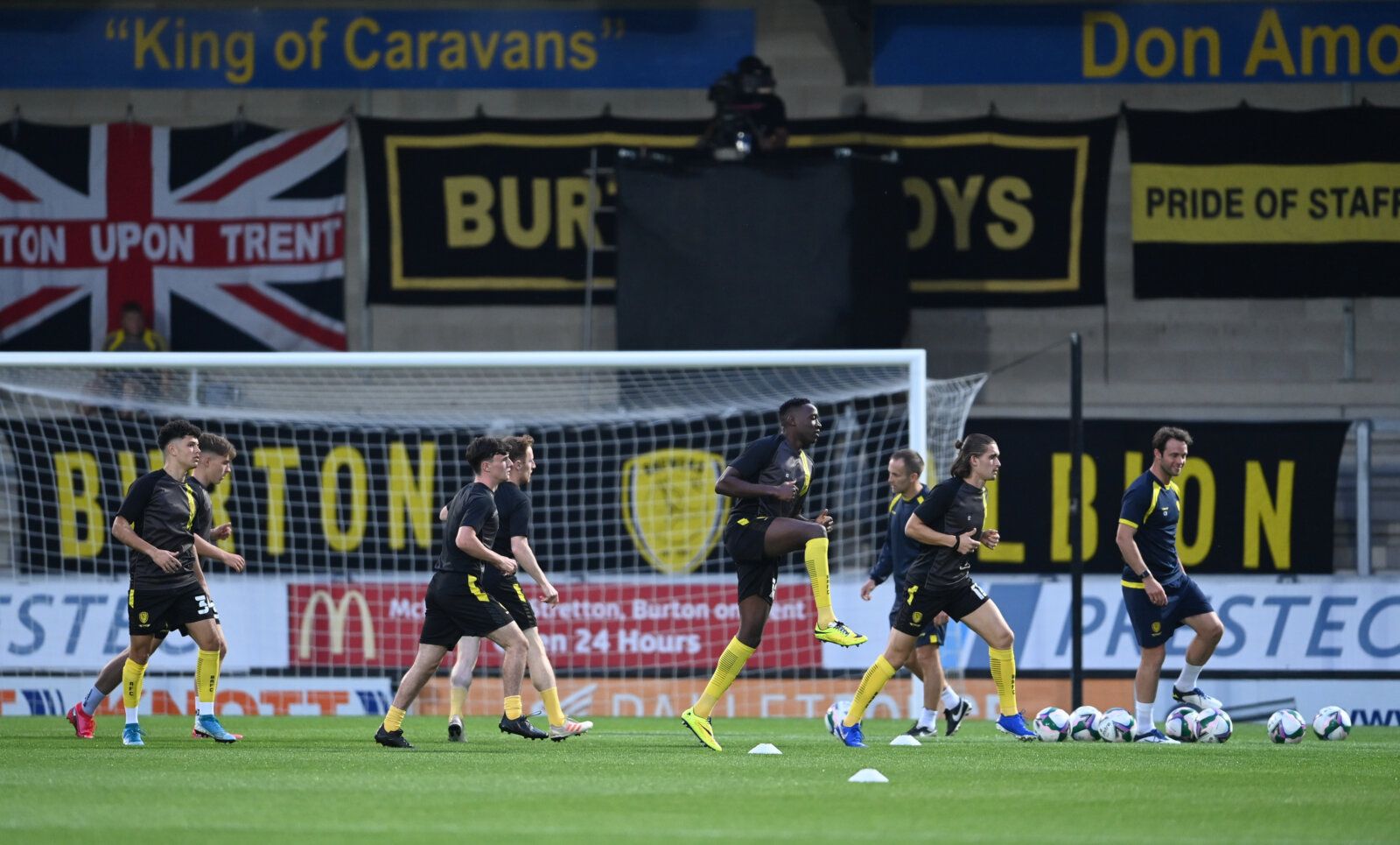 Soccer Football - Carabao Cup Second Round - Burton Albion v Aston Villa - Pirelli Stadium, Burton-on-Trent, Britain - September 15, 2020 Burton Albion's players during the warm up before the match Pool via REUTERS/Laurence Griffiths EDITORIAL USE ONLY. No use with unauthorized audio, video, data, fixture lists, club/league logos or 'live' services. Online in-match use limited to 75 images, no video emulation. No use in betting, games or single club/league/player publications.  Please contact yo
